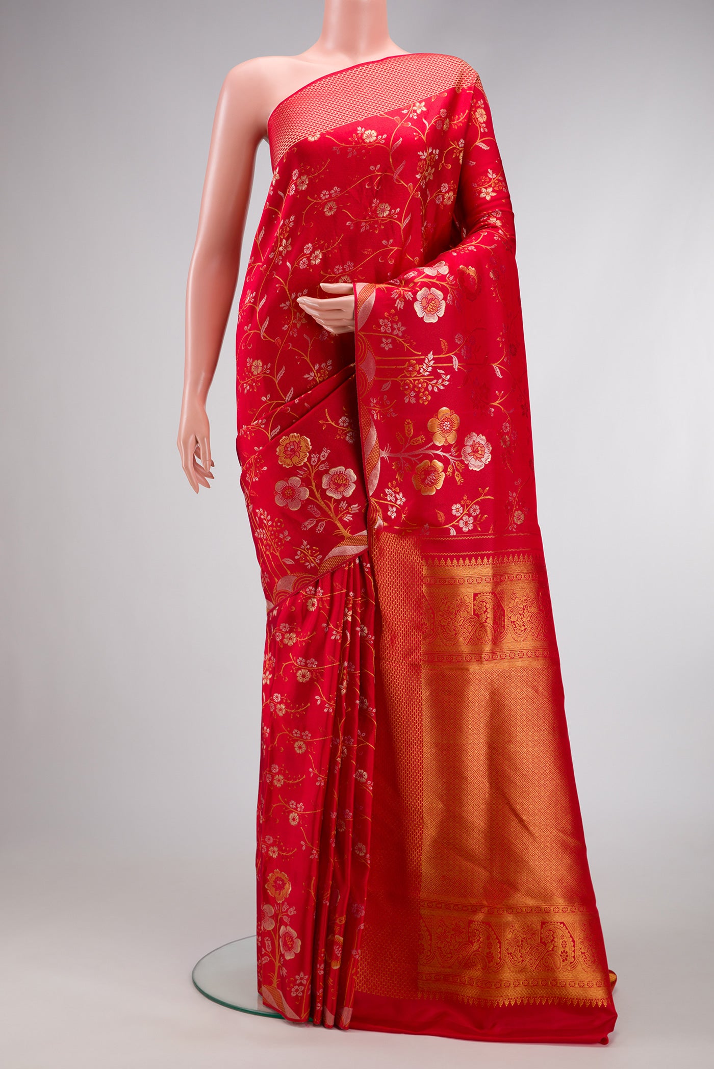 Red Dual Tone Kanchipuram Silk Saree with Zari Brocade on the body and Fancy Border.  displayed on a mannequin