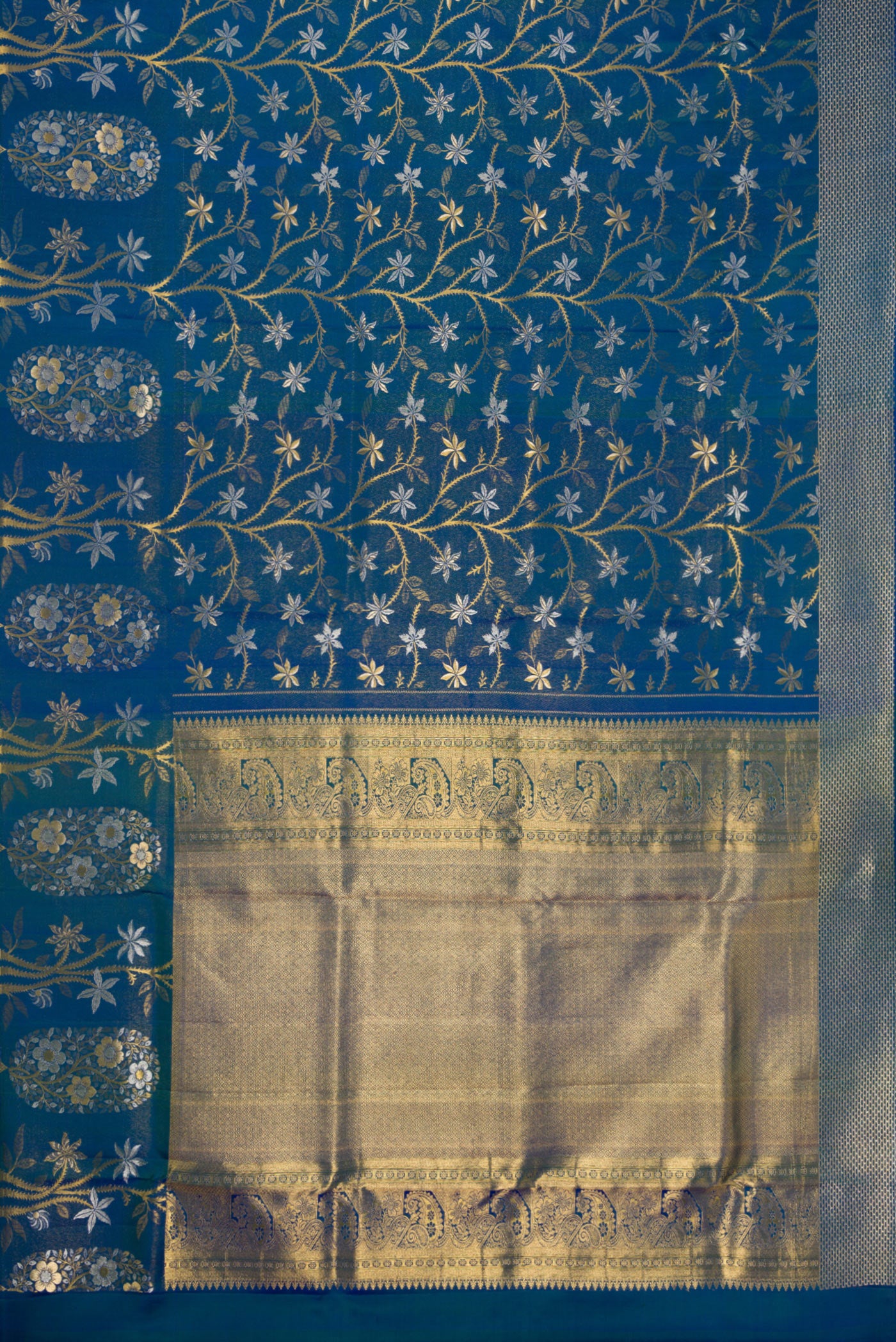 Flat view of Peacock Blue Dual Tone Kanchipuram Silk Saree with Zari Brocade on the body and Fancy Border. 