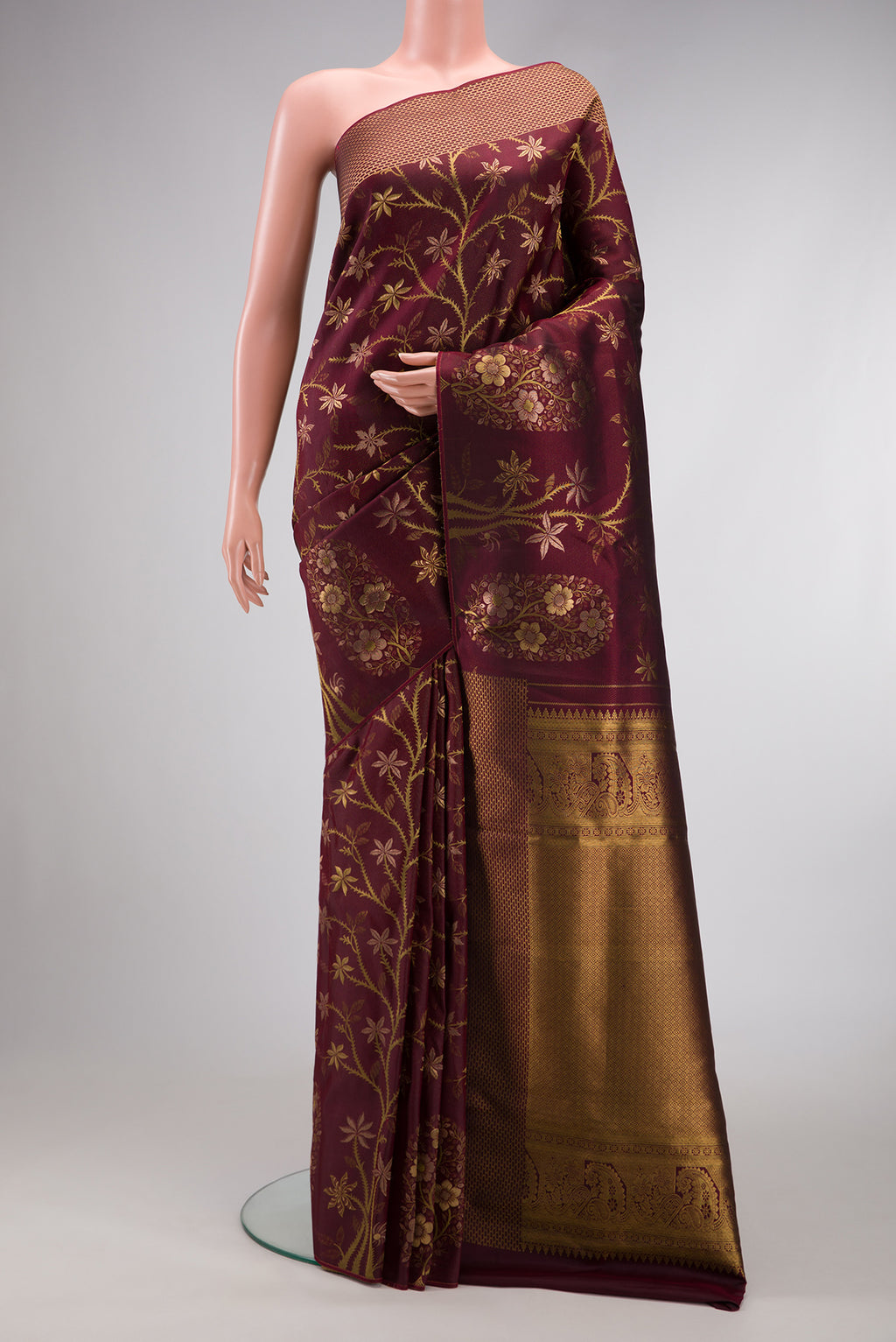 Maroon Dual Tone Kanchipuram Silk Saree with Zari Brocade on the body and Fancy Border.  displayed on a mannequin