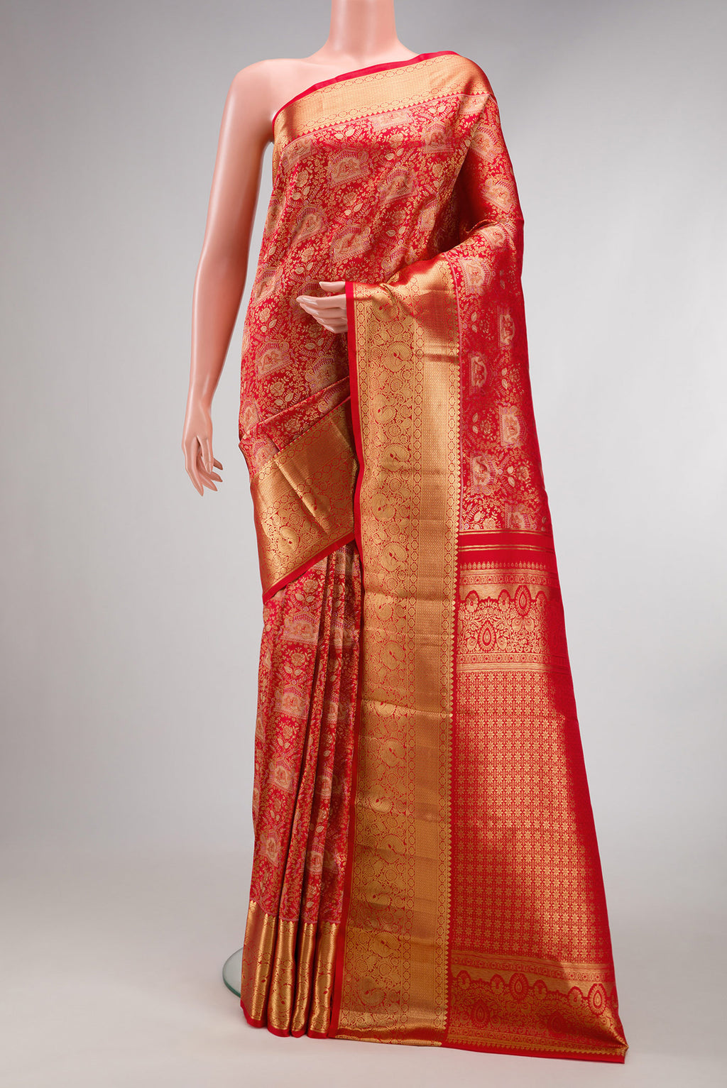 Red Dual Tone Kanchipuram Silk Saree with Zari Brocade on the body and Zari Border.  displayed on a mannequin