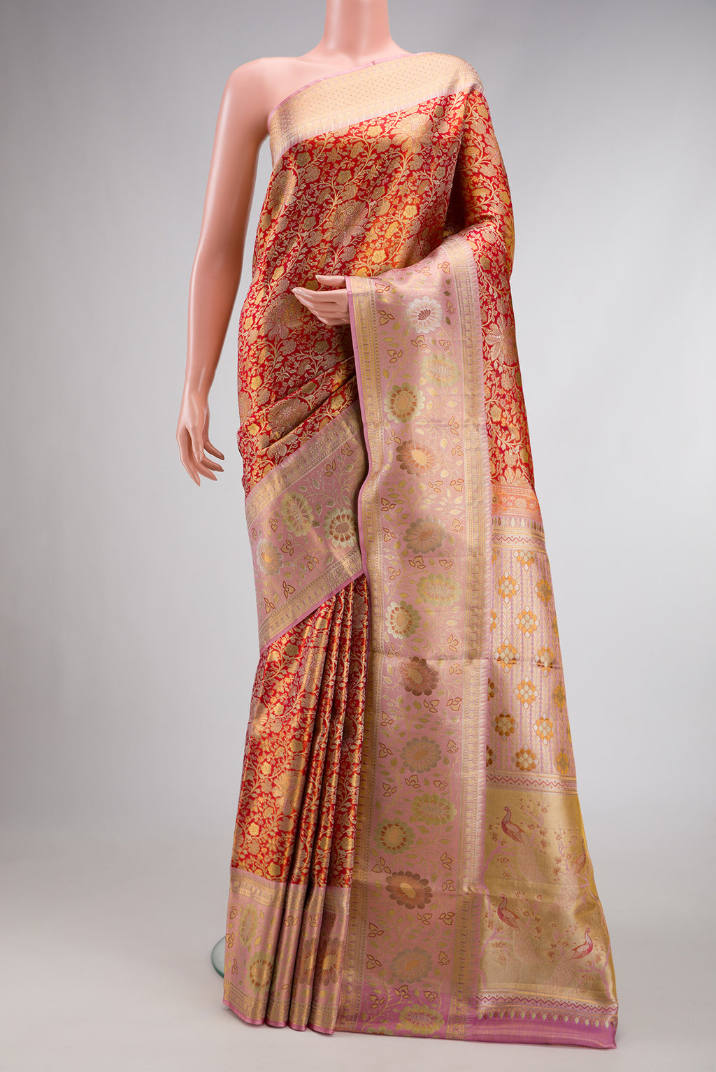 Red Dual Tone Kanjivaram Tissue Silk Saree with Zari Brocade on the body and Zari Border.  displayed on a mannequin