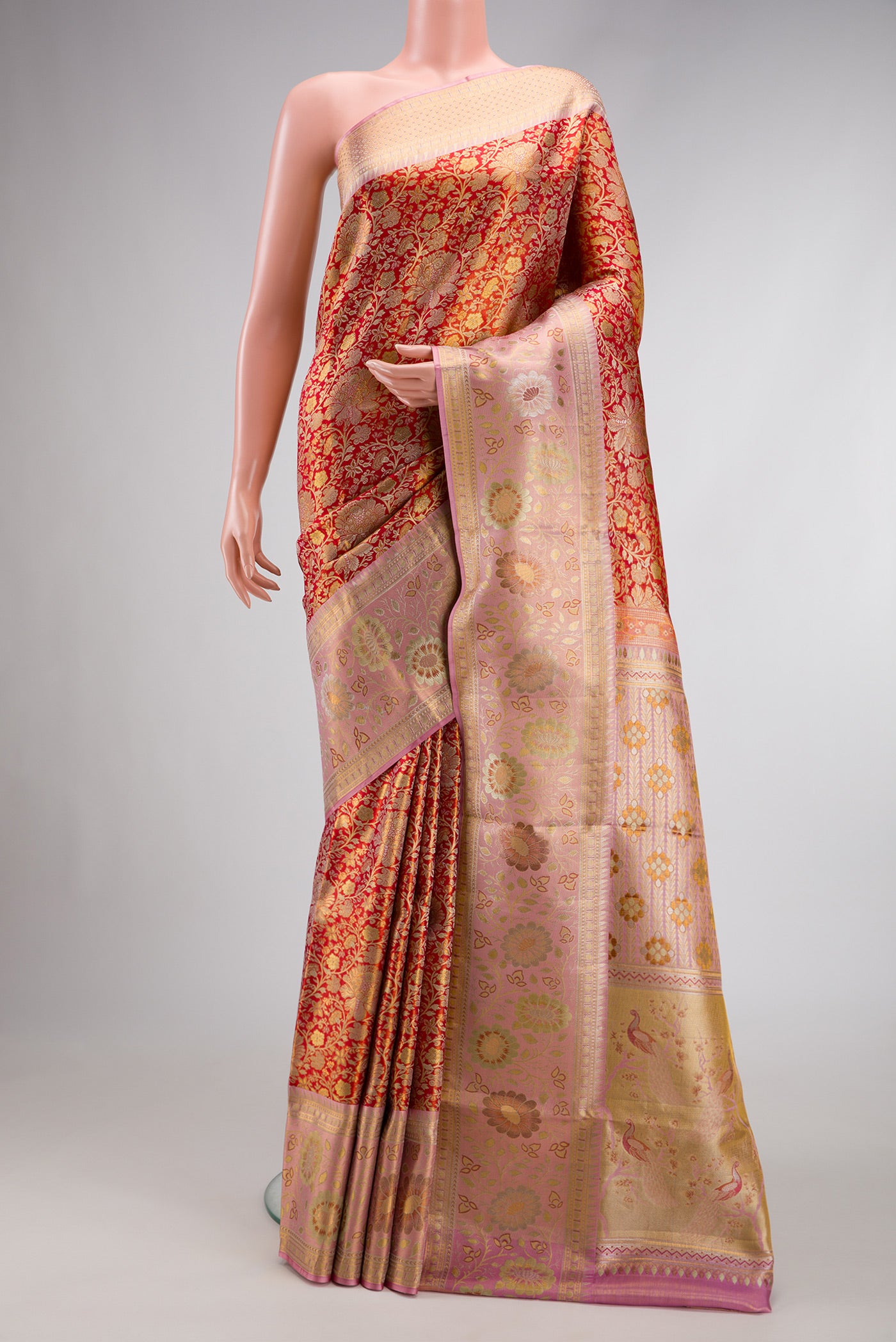 Red Dual Tone Kanjivaram Tissue Silk Saree with Zari Brocade on the body and Zari Border.  displayed on a mannequin