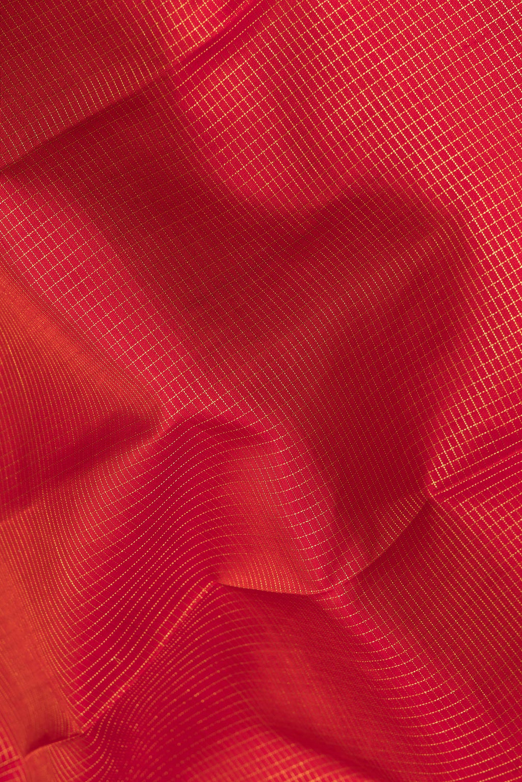 Close up of Pure Silk Maroon Dual Tone Kanjivaram Saree with Checked design on the body and Fancy Border.  displaying folds