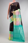 Coffee Brown Kanchipuram Silk Saree with Checked design on the body and Fancy Border.  displayed on a mannequin