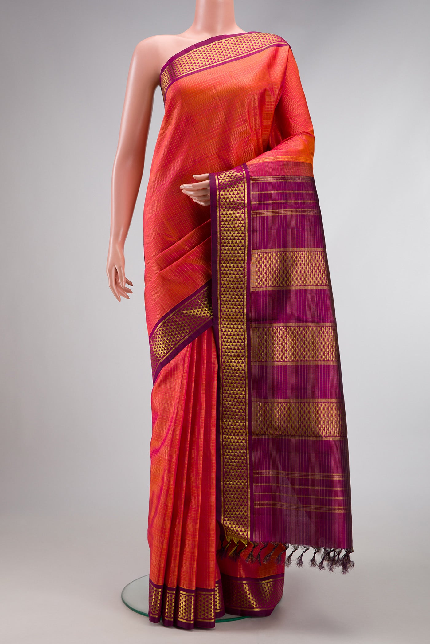 Pure Silk Pure Zari Coral Dual Tone Kanchipuram Nine Yards Saree with Checked design on the body and Zari Border.  displayed on a mannequin