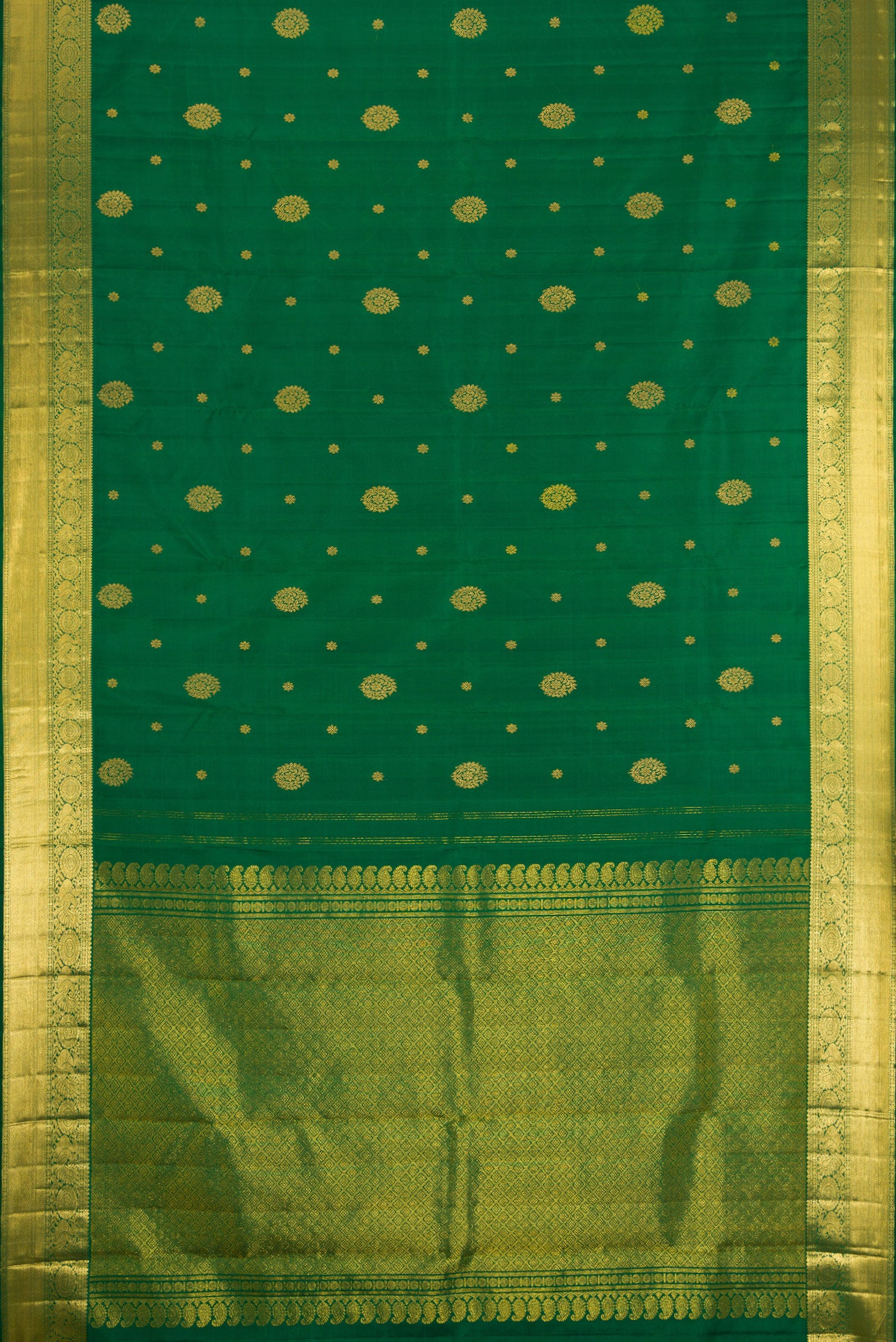 Flat view of Bottle Green Kanjivaram Silk Saree with Zari Butta on the body and Zari Border. 