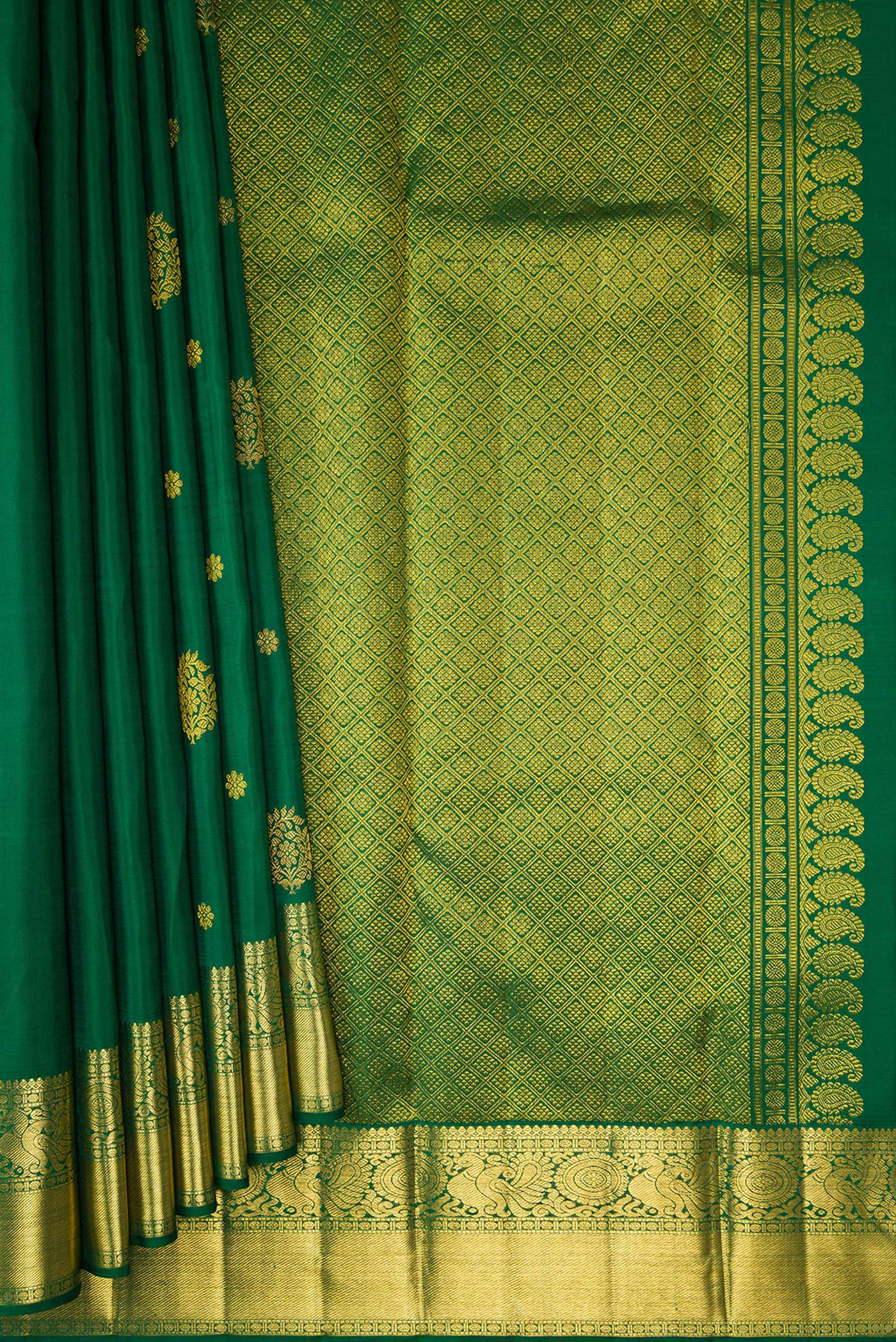 Pleats and pallu of Bottle Green Kanjivaram Silk Saree with Zari Butta on the body and Zari Border. 