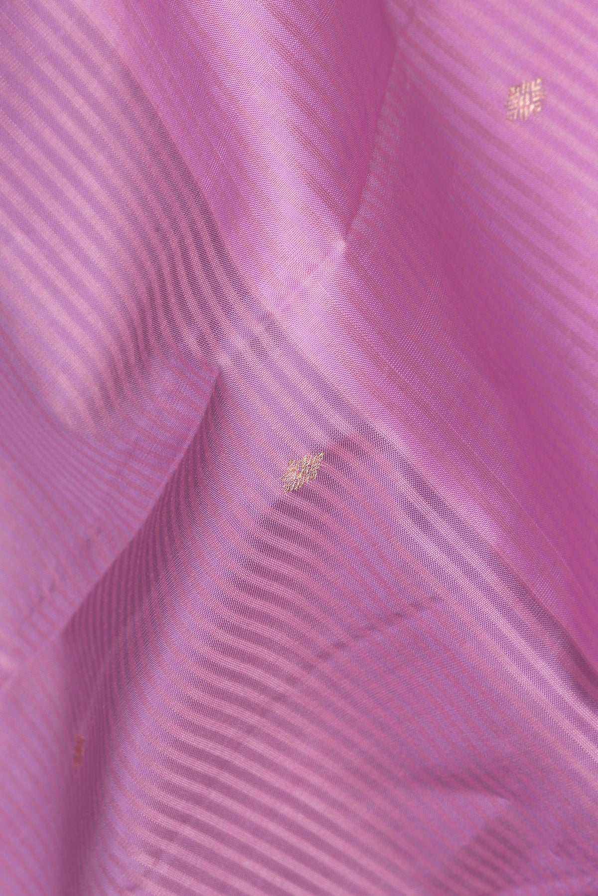 Close up of Pure Silk Lavender Dual Tone Kanchipuram Saree with Stripes on the body and Zari Border.  displaying folds