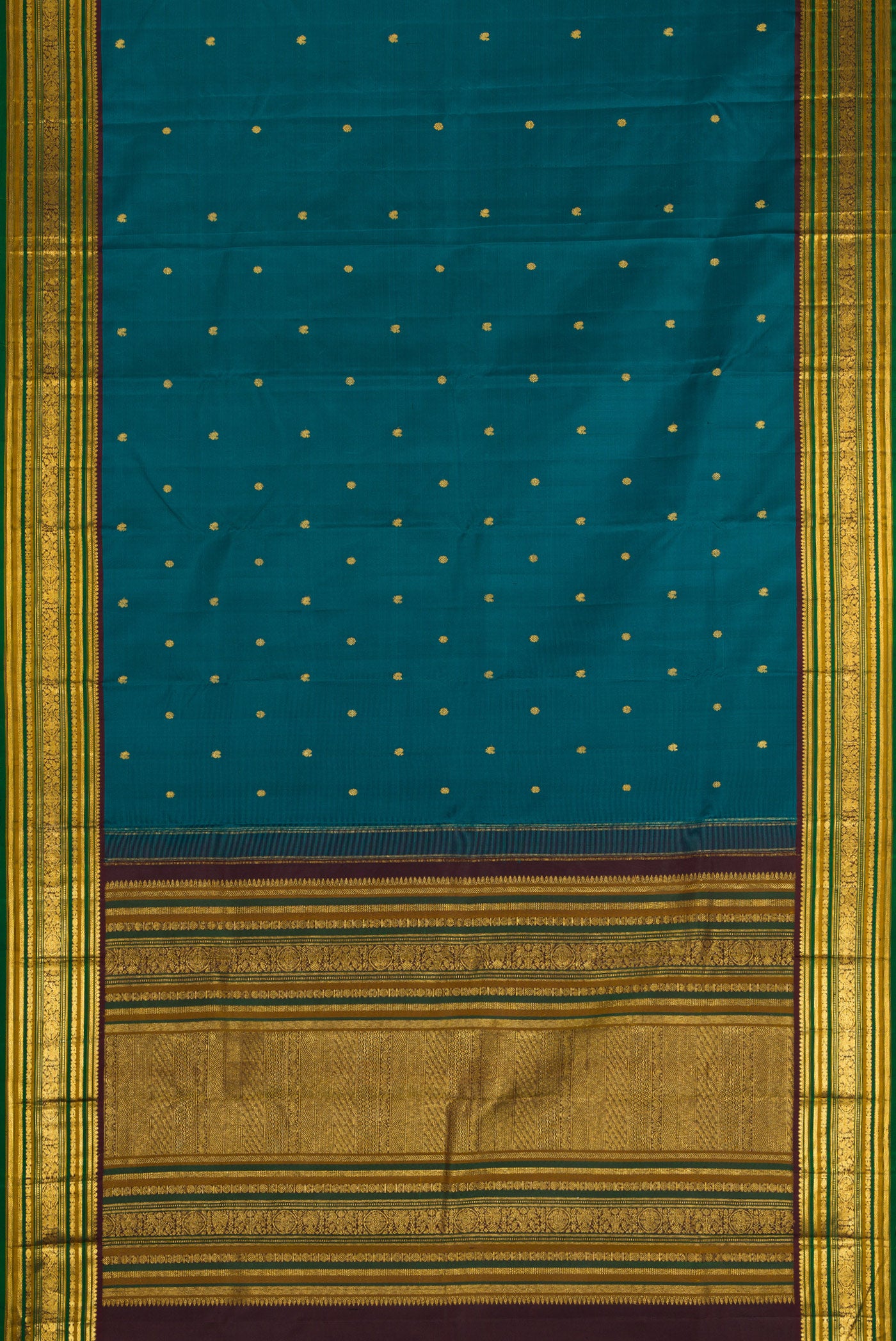 Flat view of Peacock Blue Kanjivaram Silk Saree with Zari Butta on the body and Zari Border. 