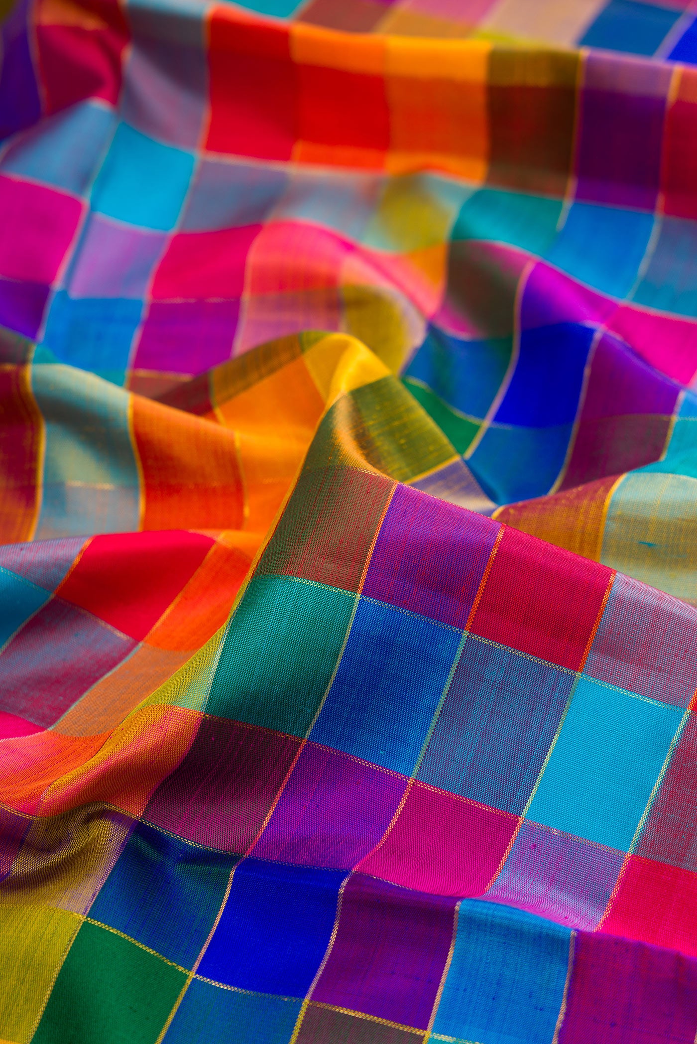 Close up of Pure Silk Pure Zari Multi Color Kanchipuram Saree with Checked design on the body and Zari Border.  displaying folds