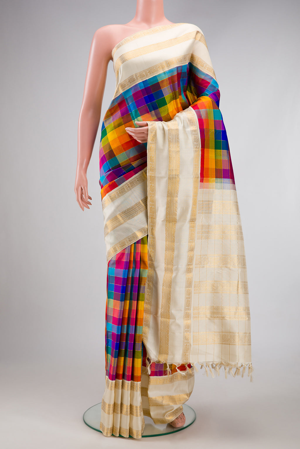 Pure Silk Pure Zari Multi Color Kanchipuram Saree with Checked design on the body and Zari Border.  displayed on a mannequin