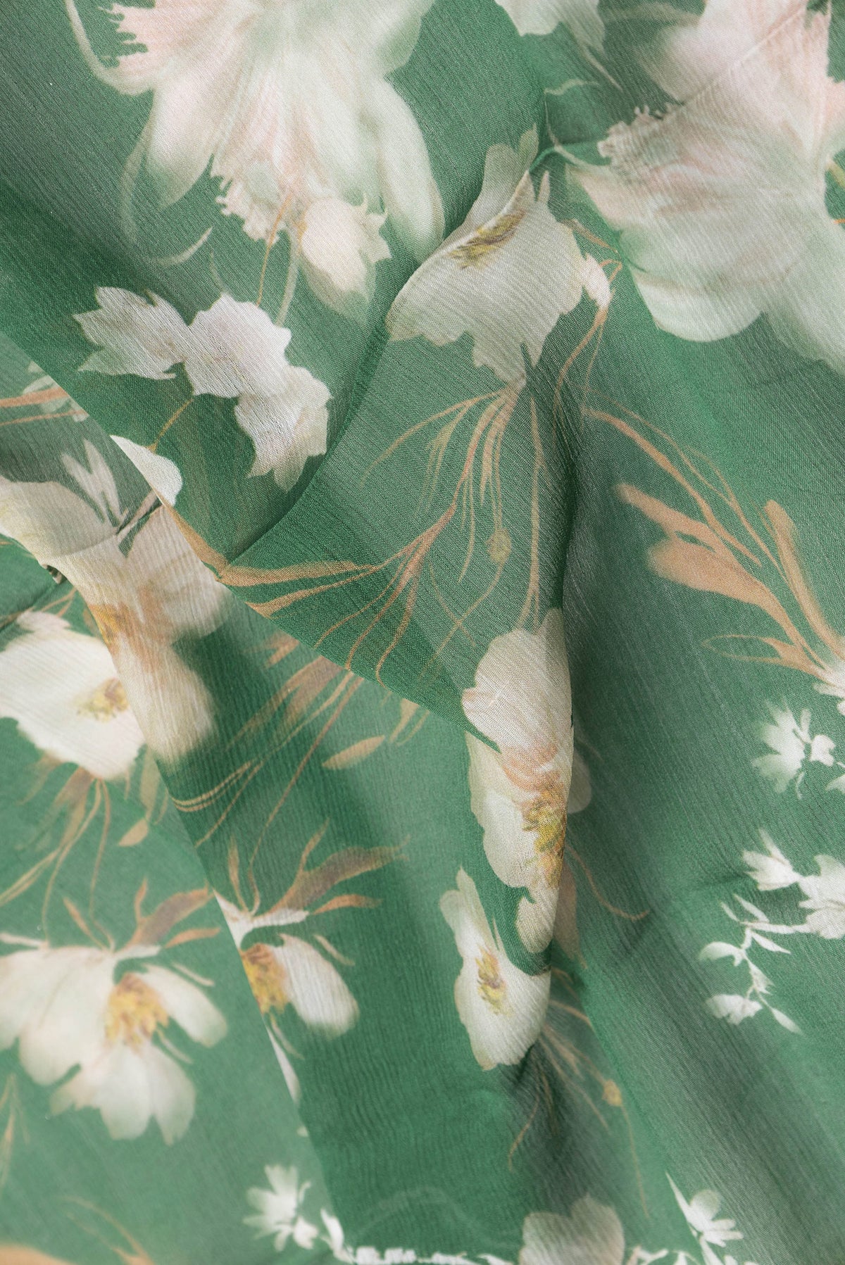Close up of Green Dual Tone Mysore Chiffon Saree with Printed design on the body and Zari Border.  displaying folds