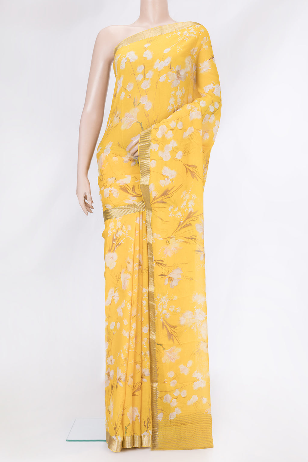 Yellow Mysore Chiffon Saree with Printed design on the body and Zari Border.  displayed on a mannequin