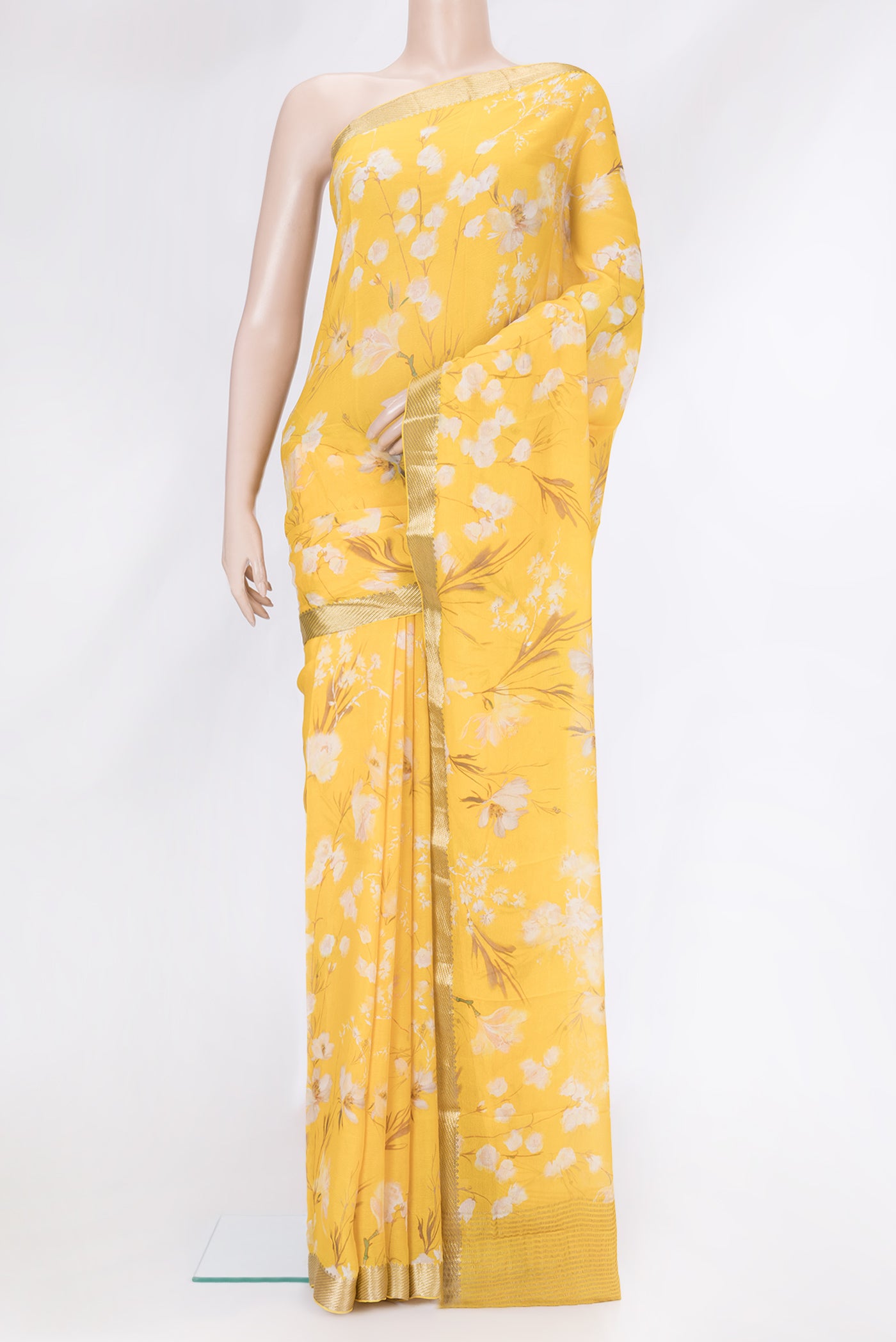Yellow Mysore Chiffon Saree with Printed design on the body and Zari Border.  displayed on a mannequin