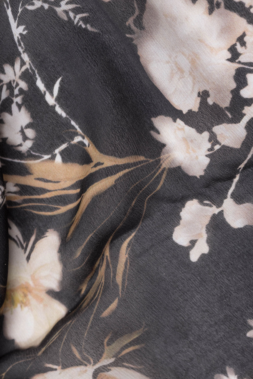 Close up of Black Mysore Chiffon Saree with Printed design on the body and Zari Border.  displaying folds