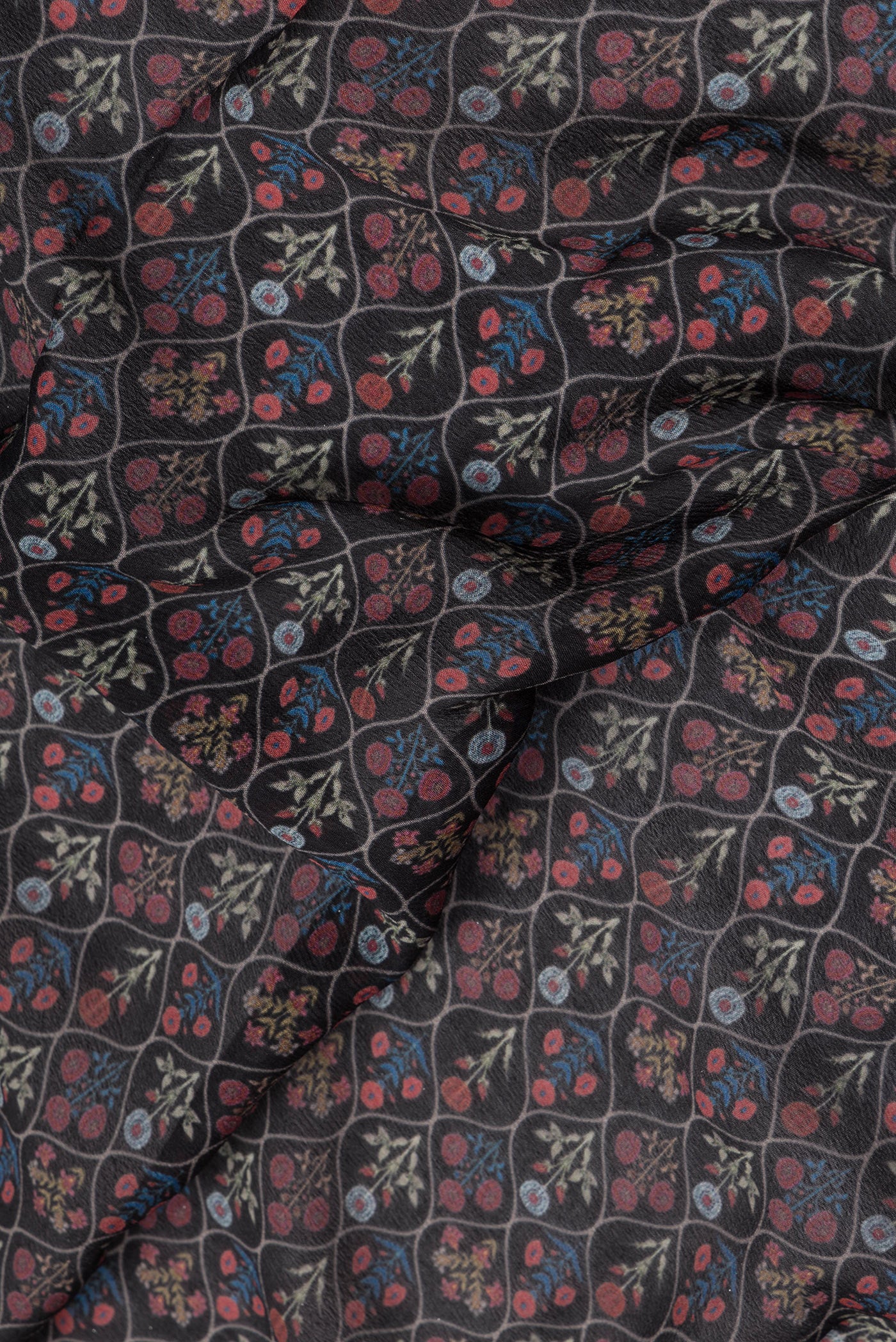 Close up of Black Mysore Chiffon Saree with Printed design on the body and Zari Border.  displaying folds