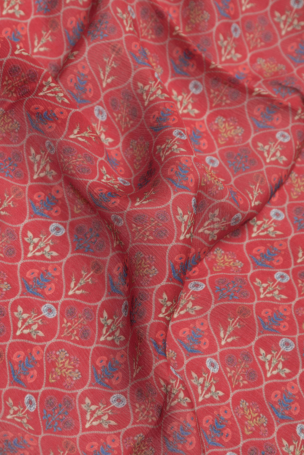 Close up of Red Mysore Chiffon Saree with Printed design on the body and Zari Border.  displaying folds