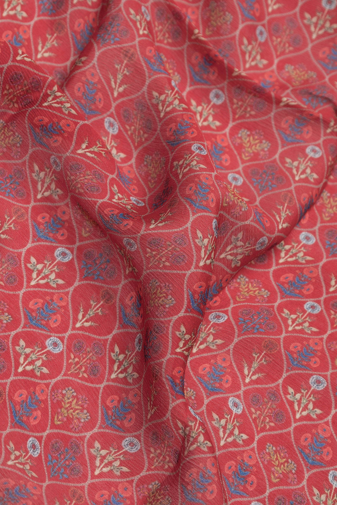 Close up of Red Mysore Chiffon Saree with Printed design on the body and Zari Border.  displaying folds