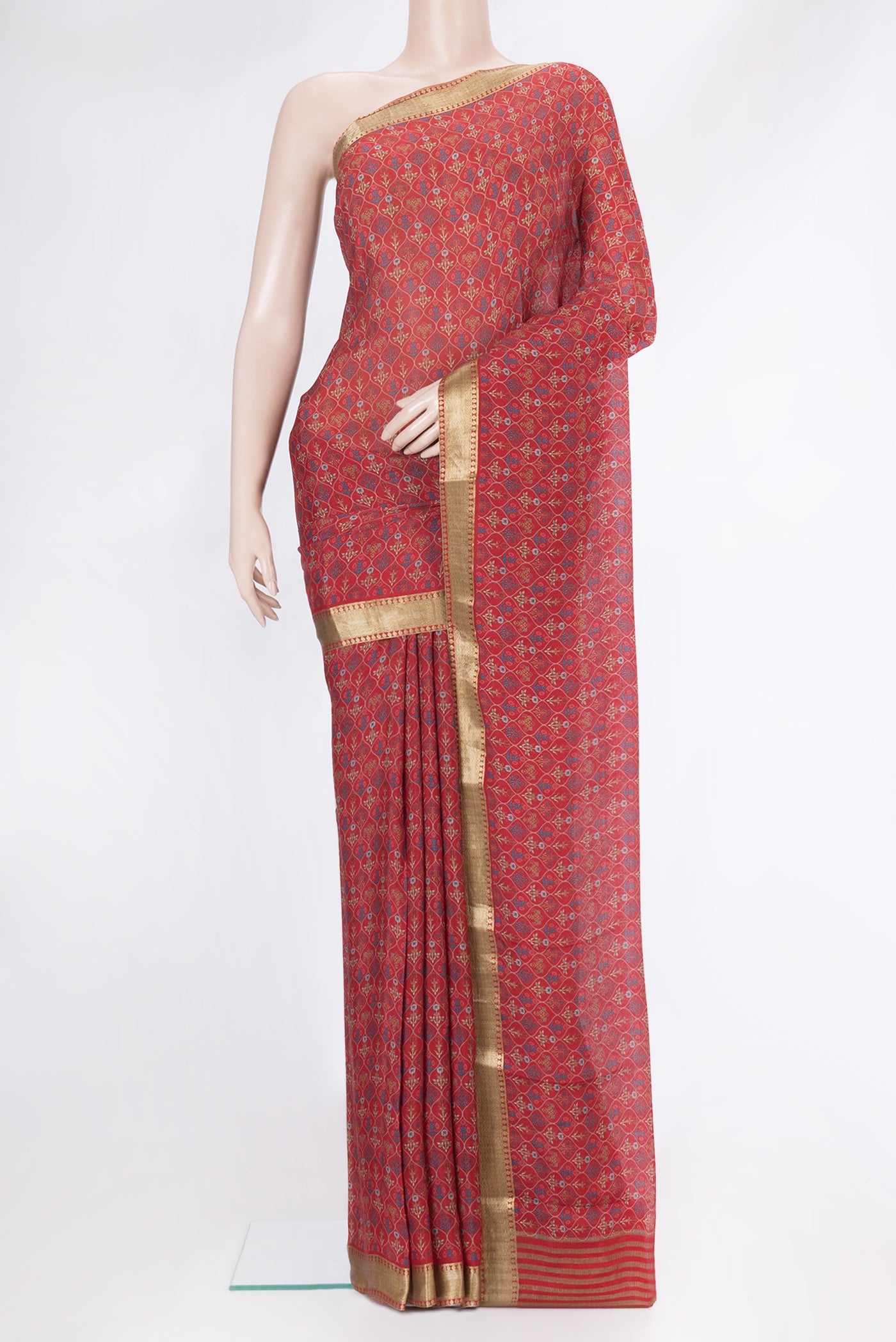 Red Mysore Chiffon Saree with Printed design on the body and Zari Border.  displayed on a mannequin