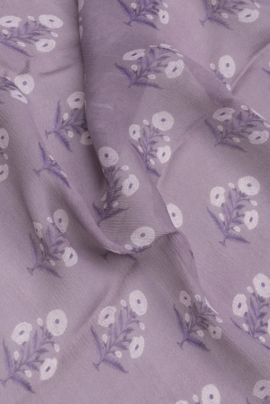Close up of Lavender Mysore Chiffon Saree with Printed design on the body and Zari Border.  displaying folds