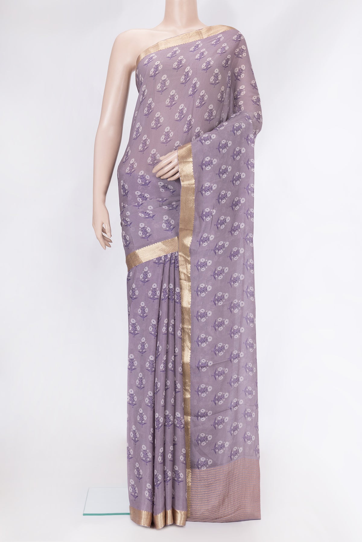 Lavender Mysore Chiffon Saree with Printed design on the body and Zari Border.  displayed on a mannequin