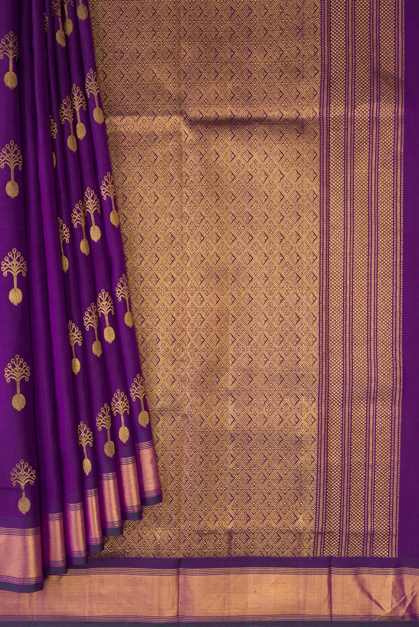 Pleats and pallu of Purple Kanjivaram Silk Saree with Zari Butta on the body and Zari Border. 