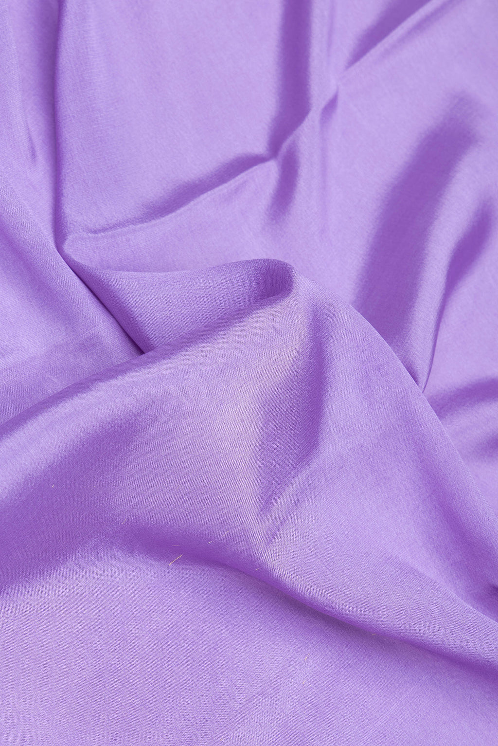 Close up of Lavender Dual Tone Mysore Silk Saree with Plain Body and Fancy Border.  displaying folds