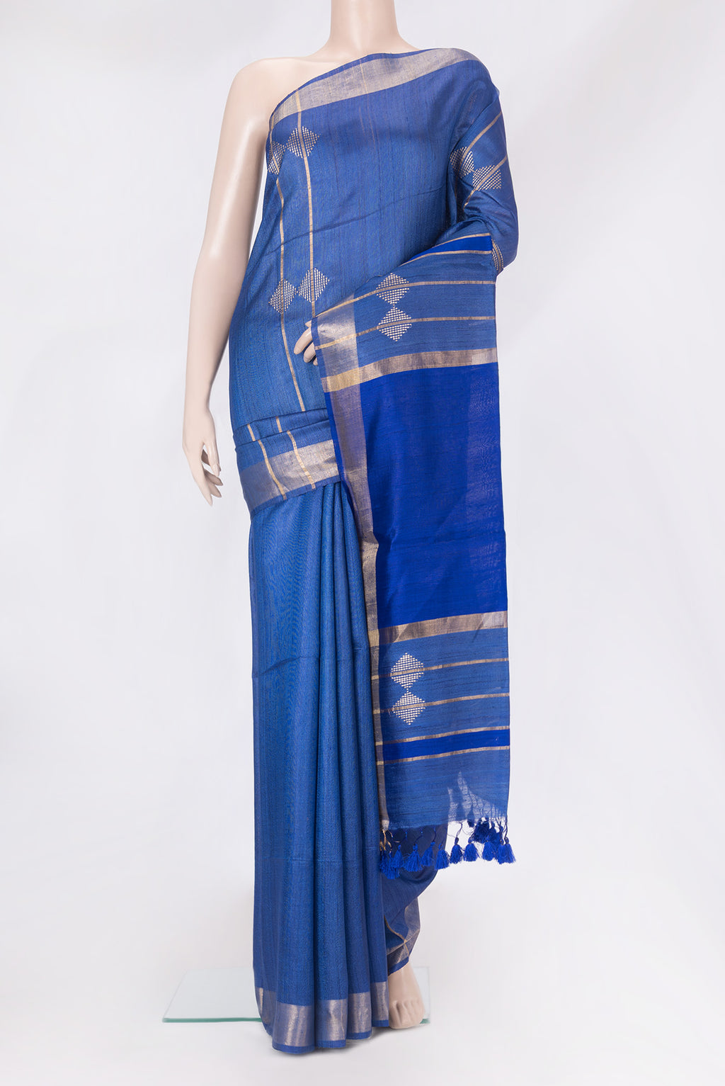 Royal Blue Tussar Silk Saree with Thread Butta on the body and Zari Border.  displayed on a mannequin