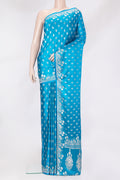 Sky Blue Blended Banarasi Silk Saree with Zari Butta on the body and Zari Border.  displayed on a mannequin