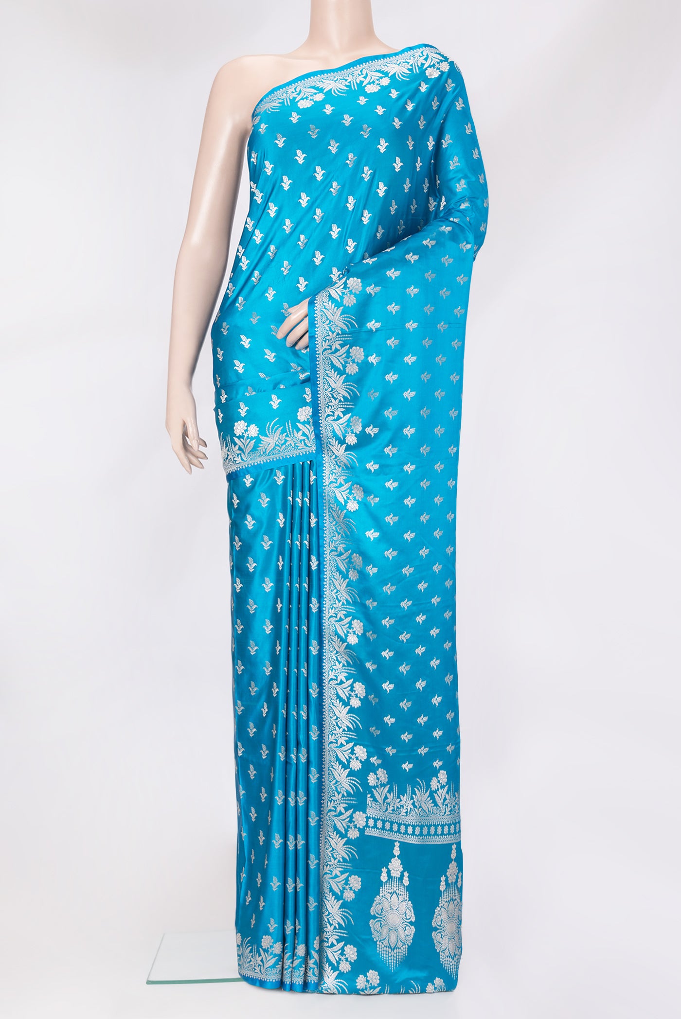 Sky Blue Blended Banarasi Silk Saree with Zari Butta on the body and Zari Border.  displayed on a mannequin