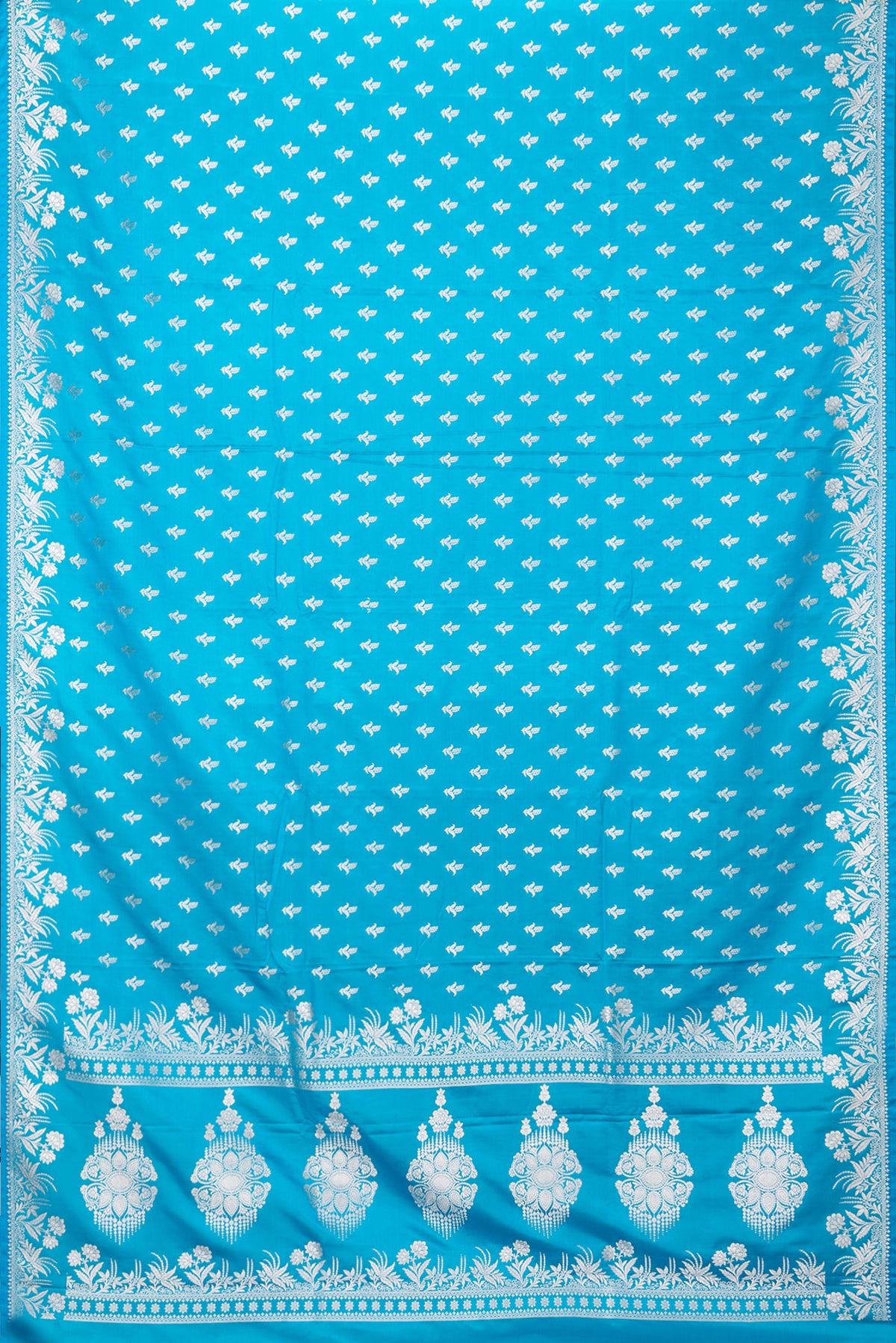 Flat view of Sky Blue Blended Banarasi Silk Saree with Zari Butta on the body and Zari Border. 
