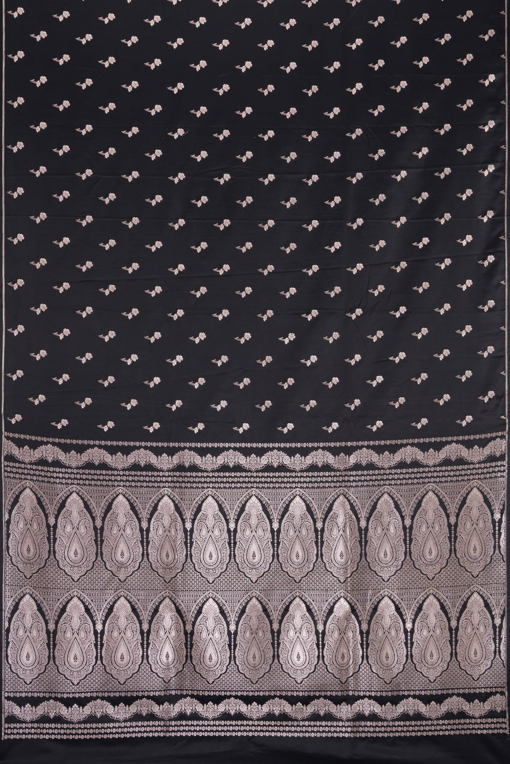 Flat view of Black Dual Tone Blended Banarasi Silk Saree with Zari Butta on the body and Thin Zari Line. 