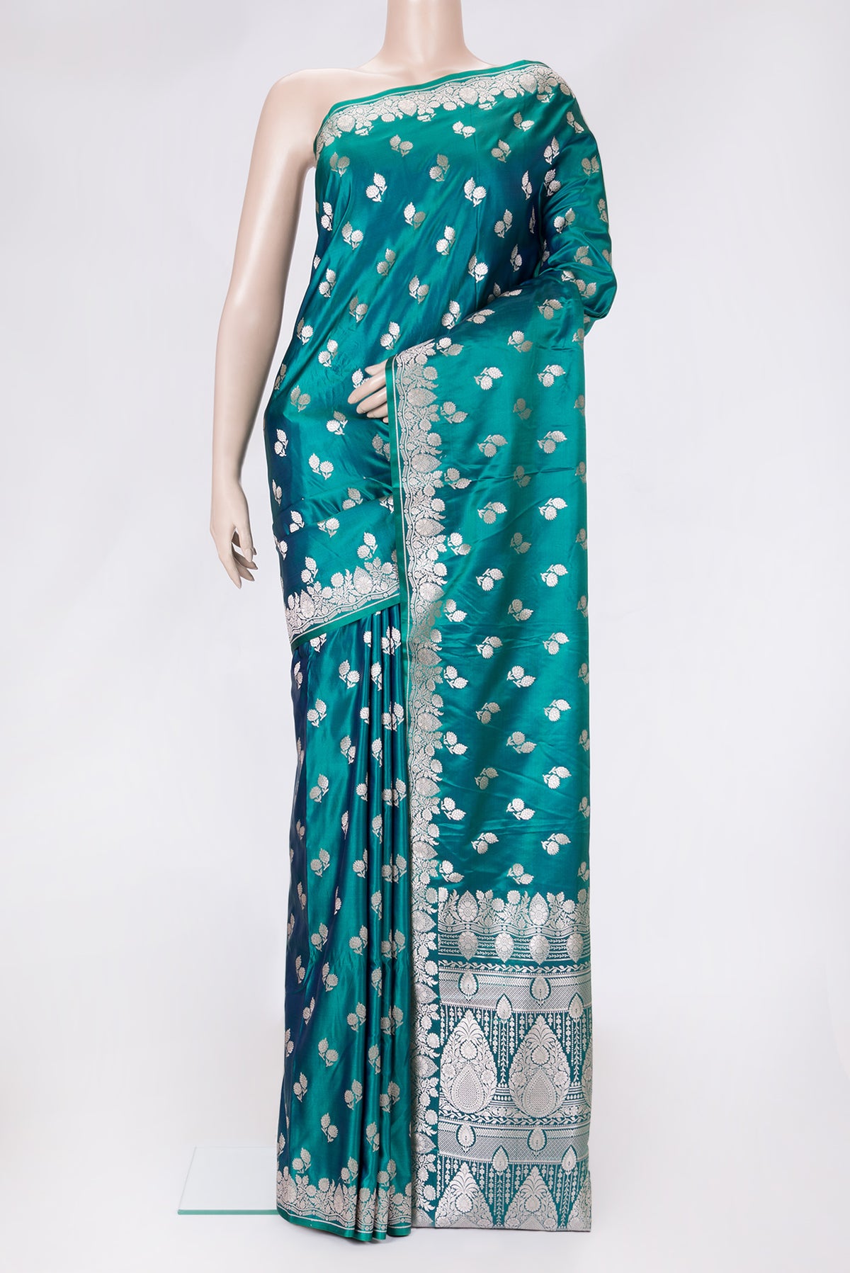 Peacock Blue Dual Tone Blended Banarasi Silk Saree with Zari Butta on the body and Zari Border.  displayed on a mannequin