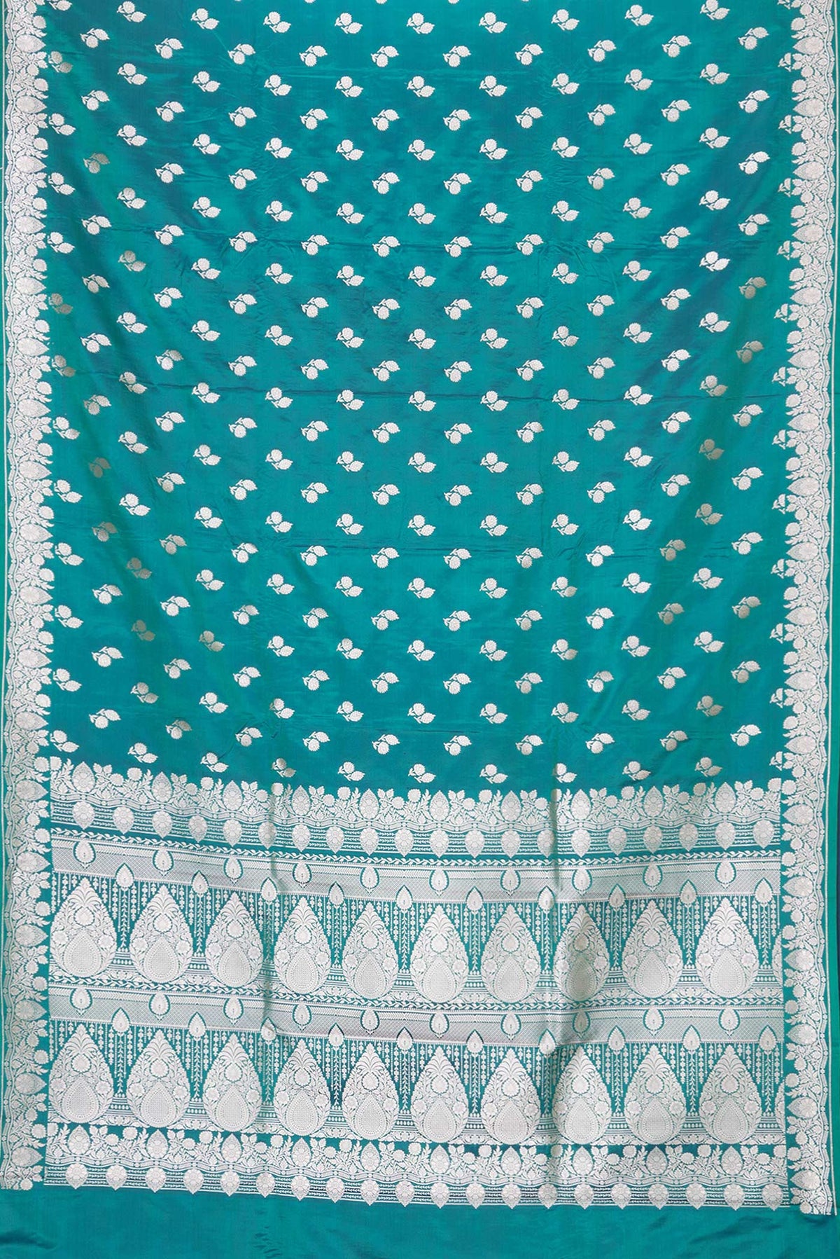 Flat view of Peacock Blue Dual Tone Blended Banarasi Silk Saree with Zari Butta on the body and Zari Border. 