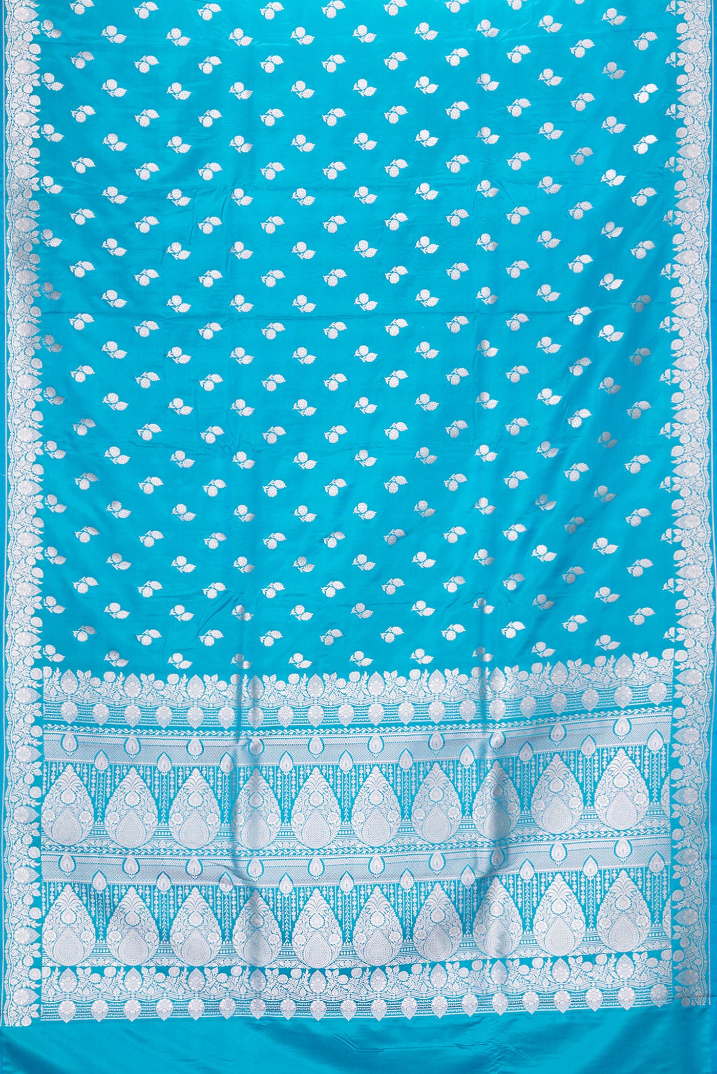 Flat view of Sky Blue Dual Tone Blended Banarasi Silk Saree with Zari Butta on the body and Zari Border. 