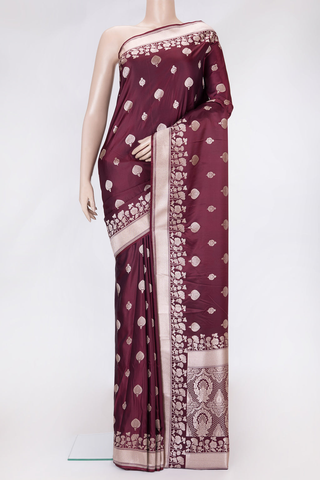 Maroon Dual Tone Blended Banarasi Silk Saree with Zari Butta on the body and Zari Border.  displayed on a mannequin