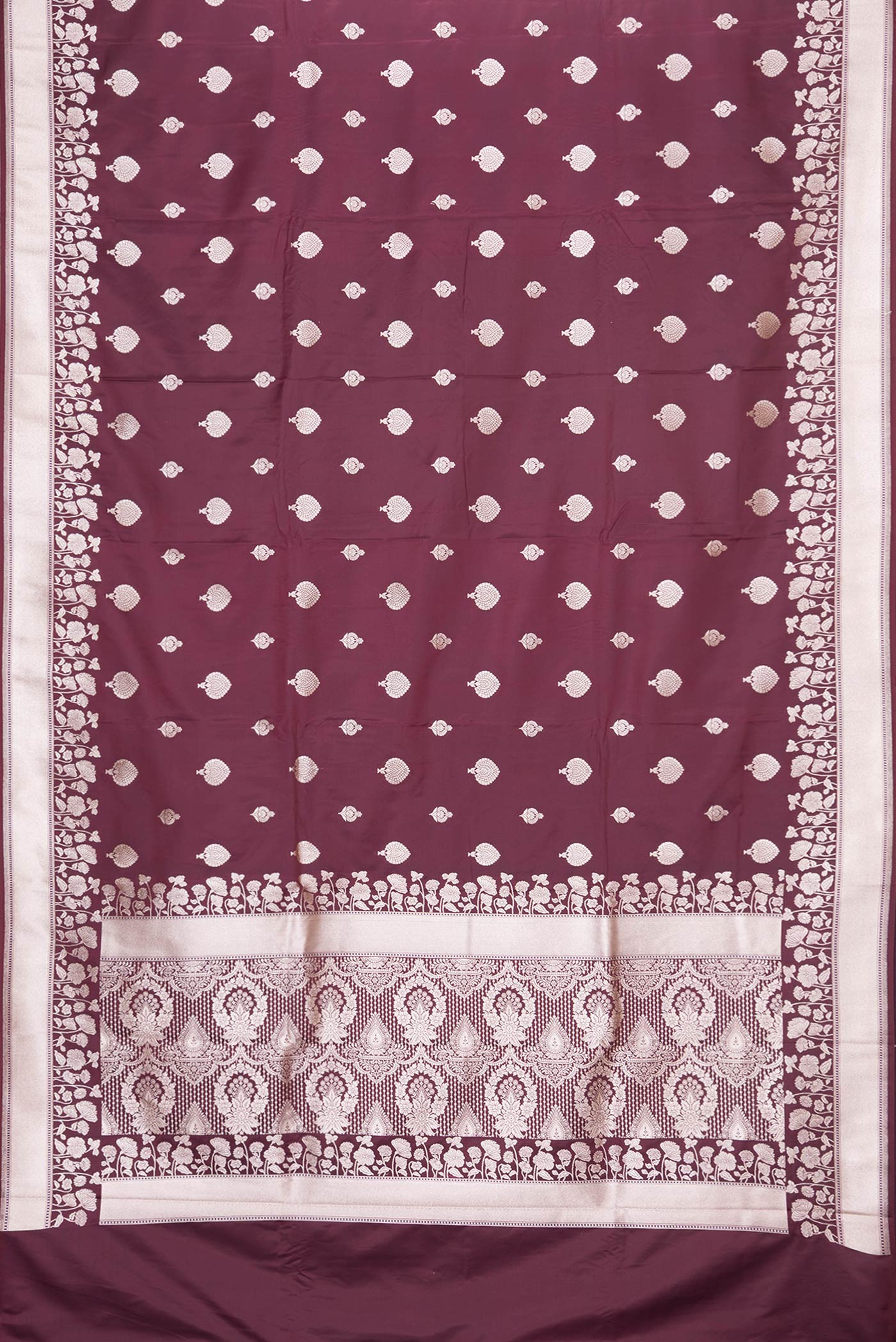 Flat view of Maroon Dual Tone Blended Banarasi Silk Saree with Zari Butta on the body and Zari Border. 