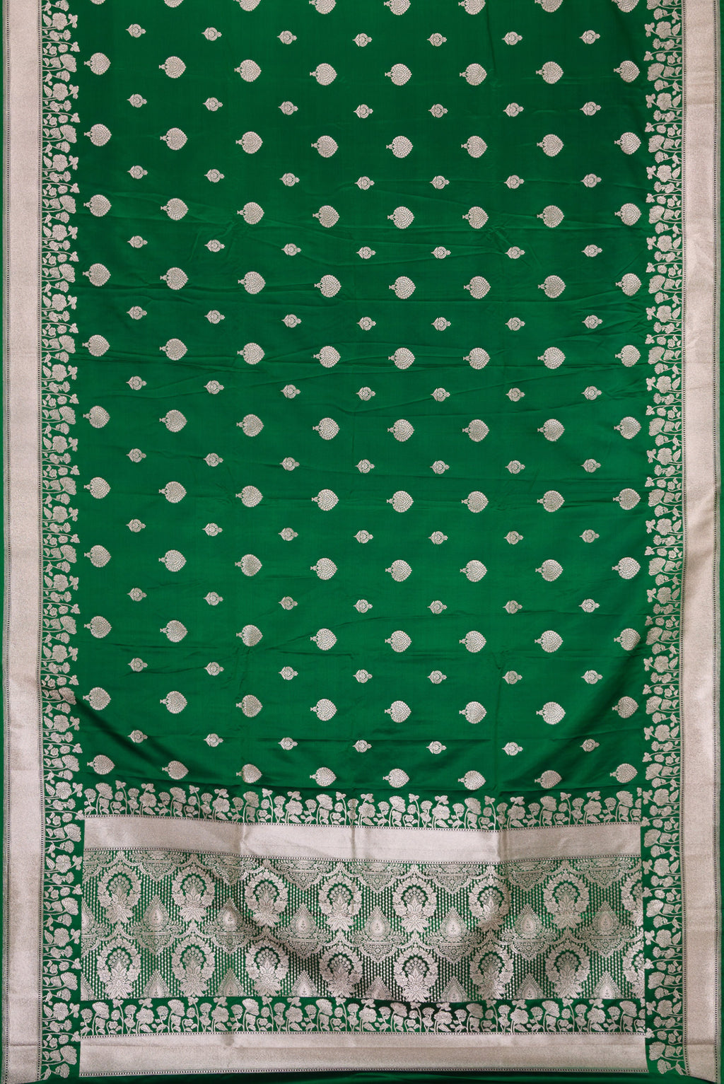 Flat view of Green Dual Tone Blended Banarasi Silk Saree with Zari Butta on the body and Zari Border. 