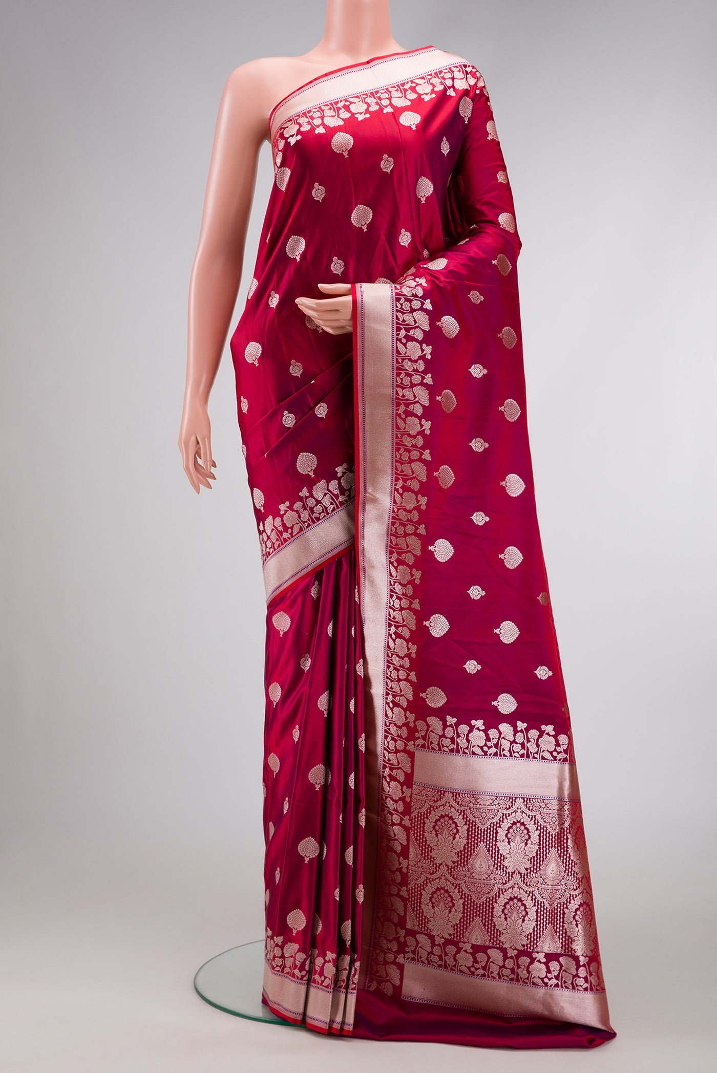 Maroon Dual Tone Blended Banarasi Silk Saree with Zari Butta on the body and Zari Border.  displayed on a mannequin