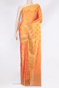 Orange Blended Banarasi Silk Saree with Zari Butta on the body and Zari Border.  displayed on a mannequin