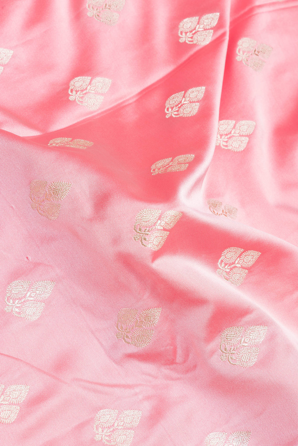 Close up of Pink Blended Banarasi Silk Saree with Zari Butta on the body and Zari Border.  displaying folds