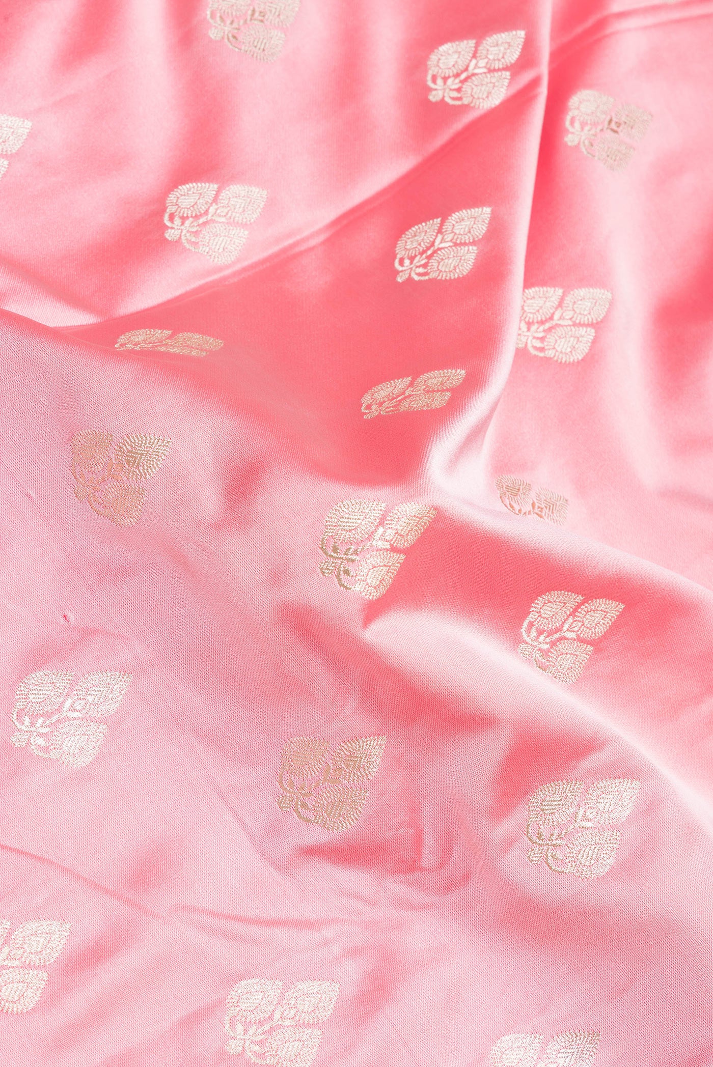 Close up of Pink Blended Banarasi Silk Saree with Zari Butta on the body and Zari Border.  displaying folds