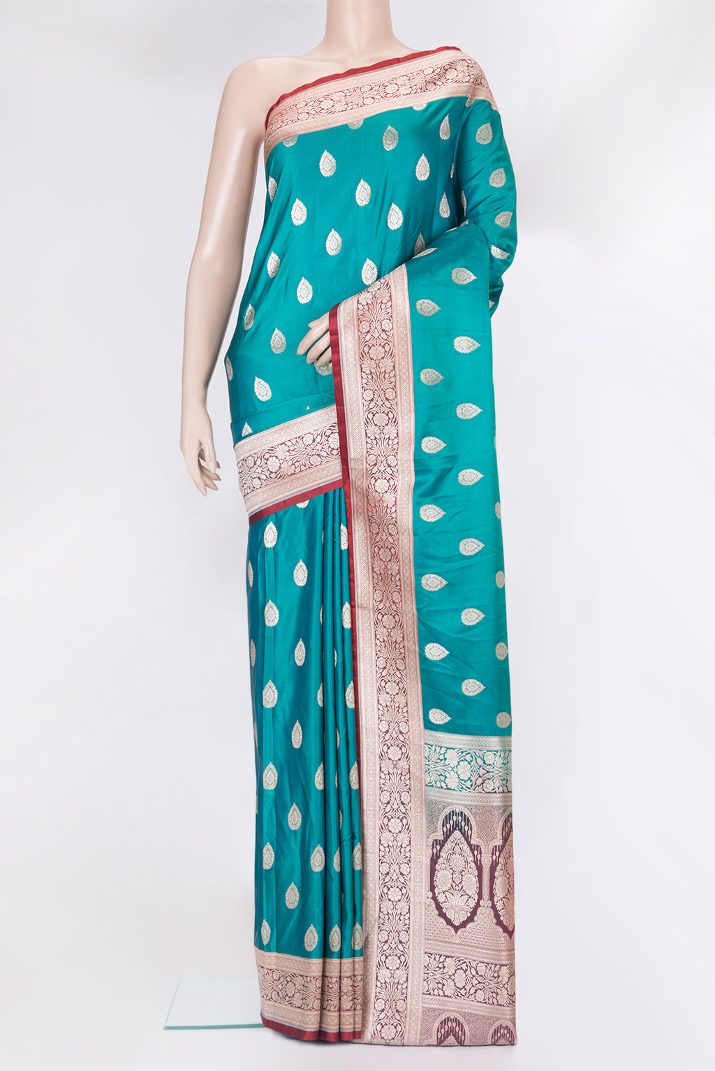 Peacock Blue Blended Banarasi Silk Saree with Zari Butta on the body and Zari Border.  displayed on a mannequin