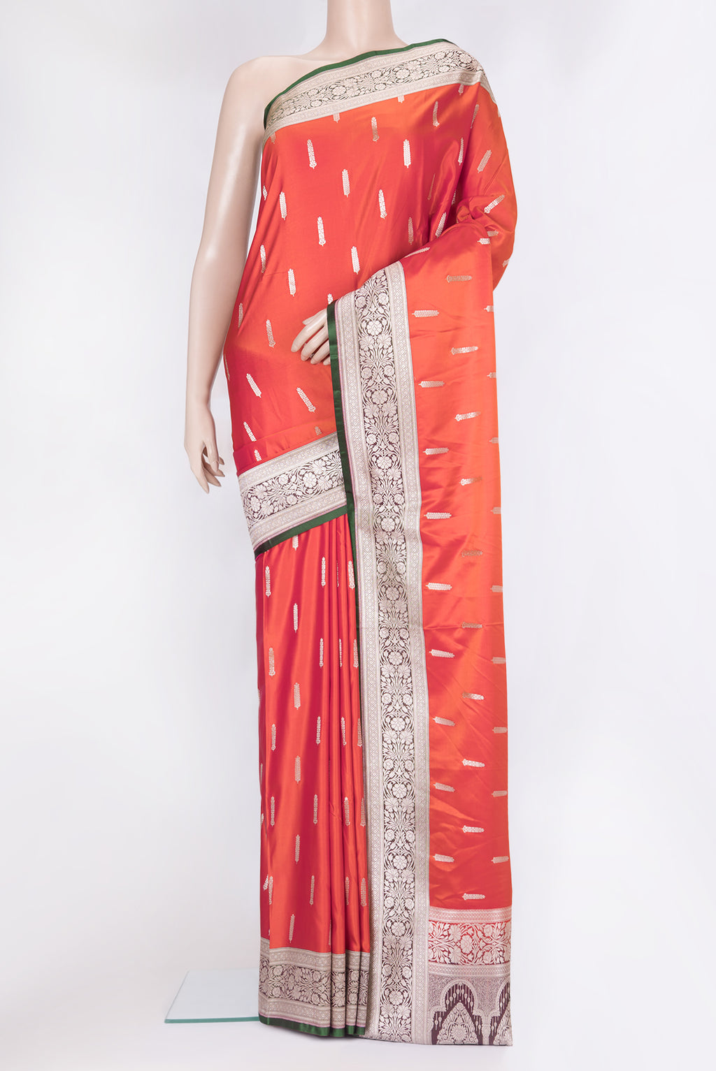 Orange Blended Banarasi Silk Saree with Zari Butta on the body and Zari Border.  displayed on a mannequin