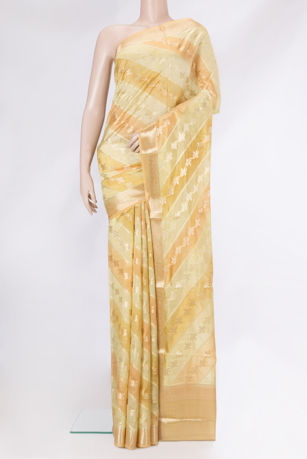 Yellow Dual Tone Banarasi Raw Silk Saree with Zari Brocade on the body and Zari Border.  displayed on a mannequin