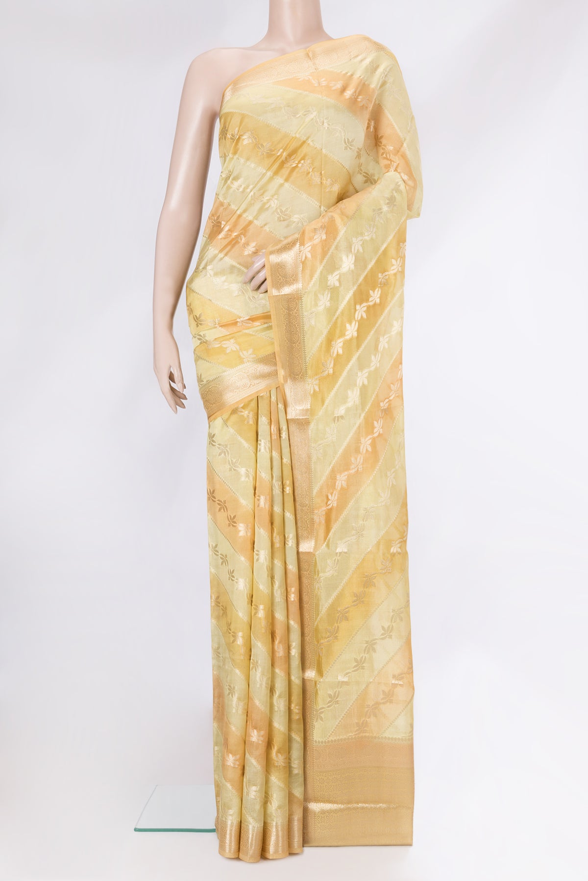Yellow Dual Tone Banarasi Raw Silk Saree with Zari Brocade on the body and Zari Border.  displayed on a mannequin