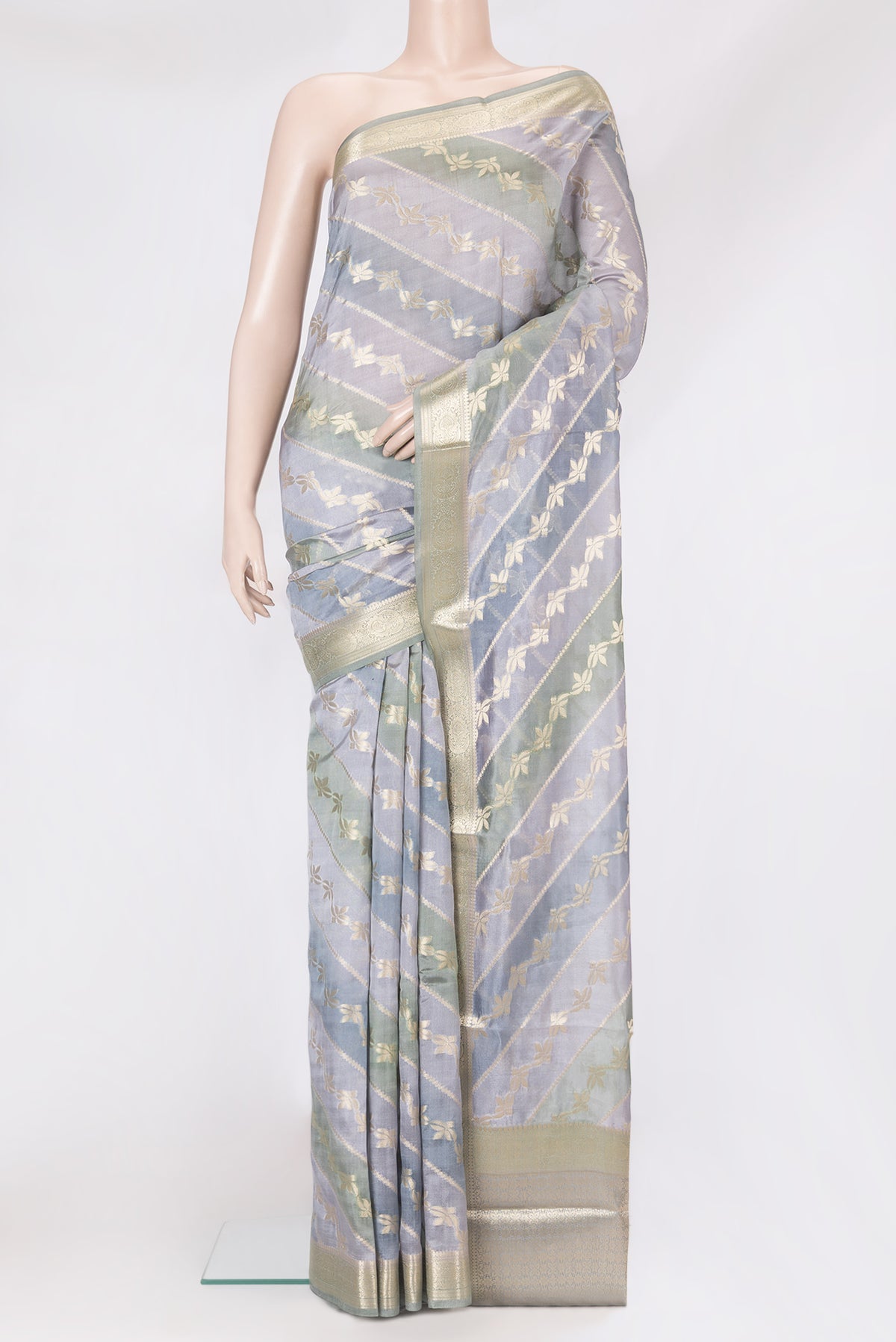 Grey Dual Tone Tussar Silk Saree with Zari Brocade on the body and Zari Border.  displayed on a mannequin
