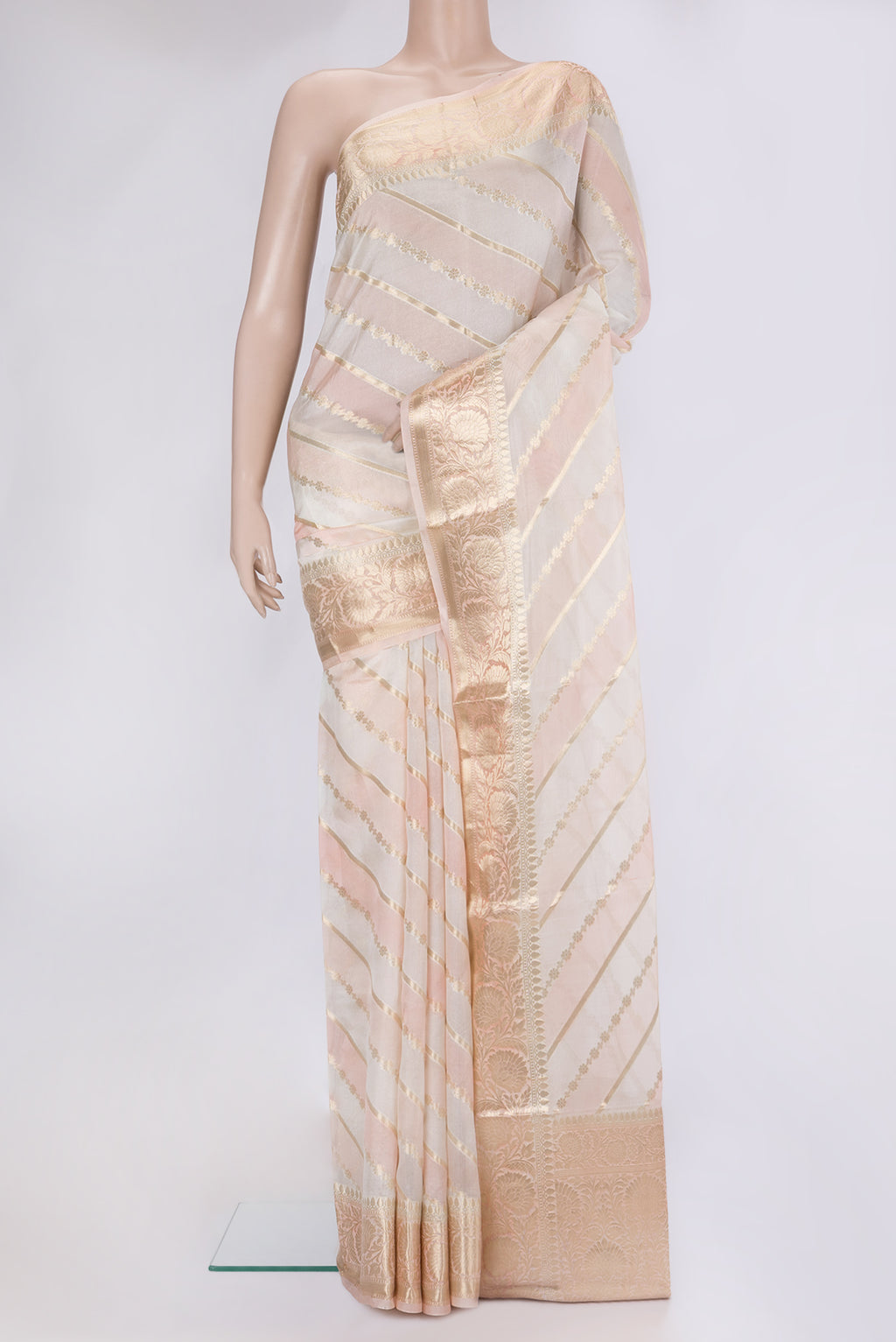 Cream Tussar Silk Saree with Zari Brocade on the body and Zari Border.  displayed on a mannequin
