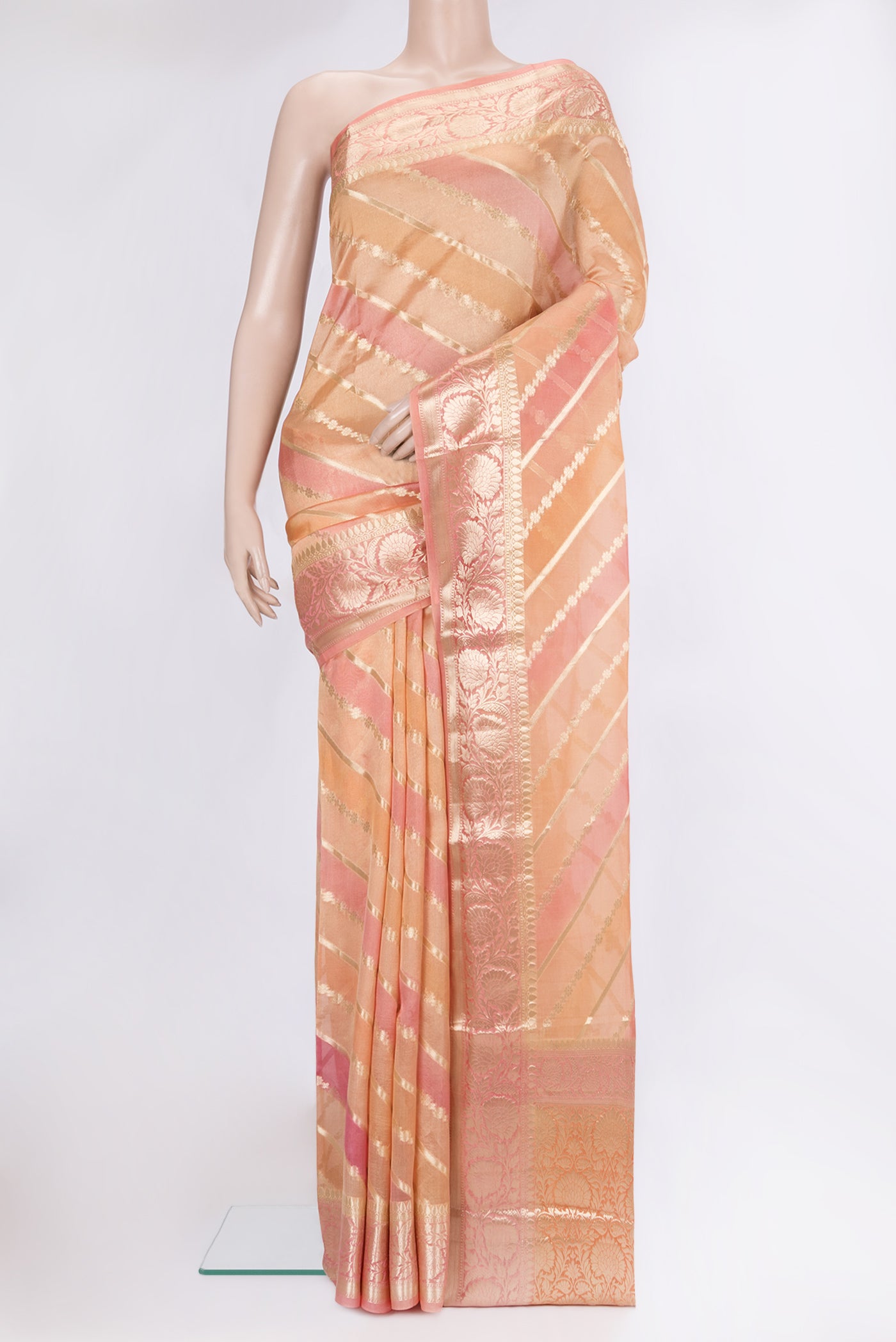 Golden Peach Tussar Silk Saree with Zari Brocade on the body and Zari Border.  displayed on a mannequin