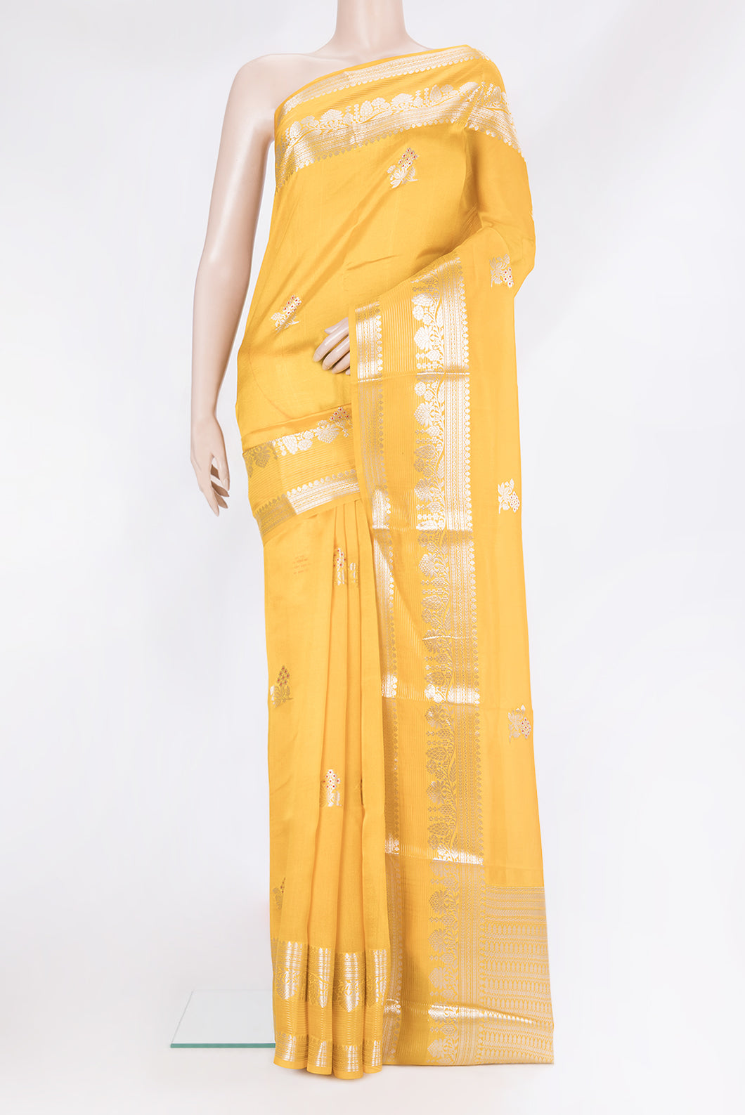 Yellow Blended Tussar Silk Saree with Zari Butta on the body and Zari Border.  displayed on a mannequin